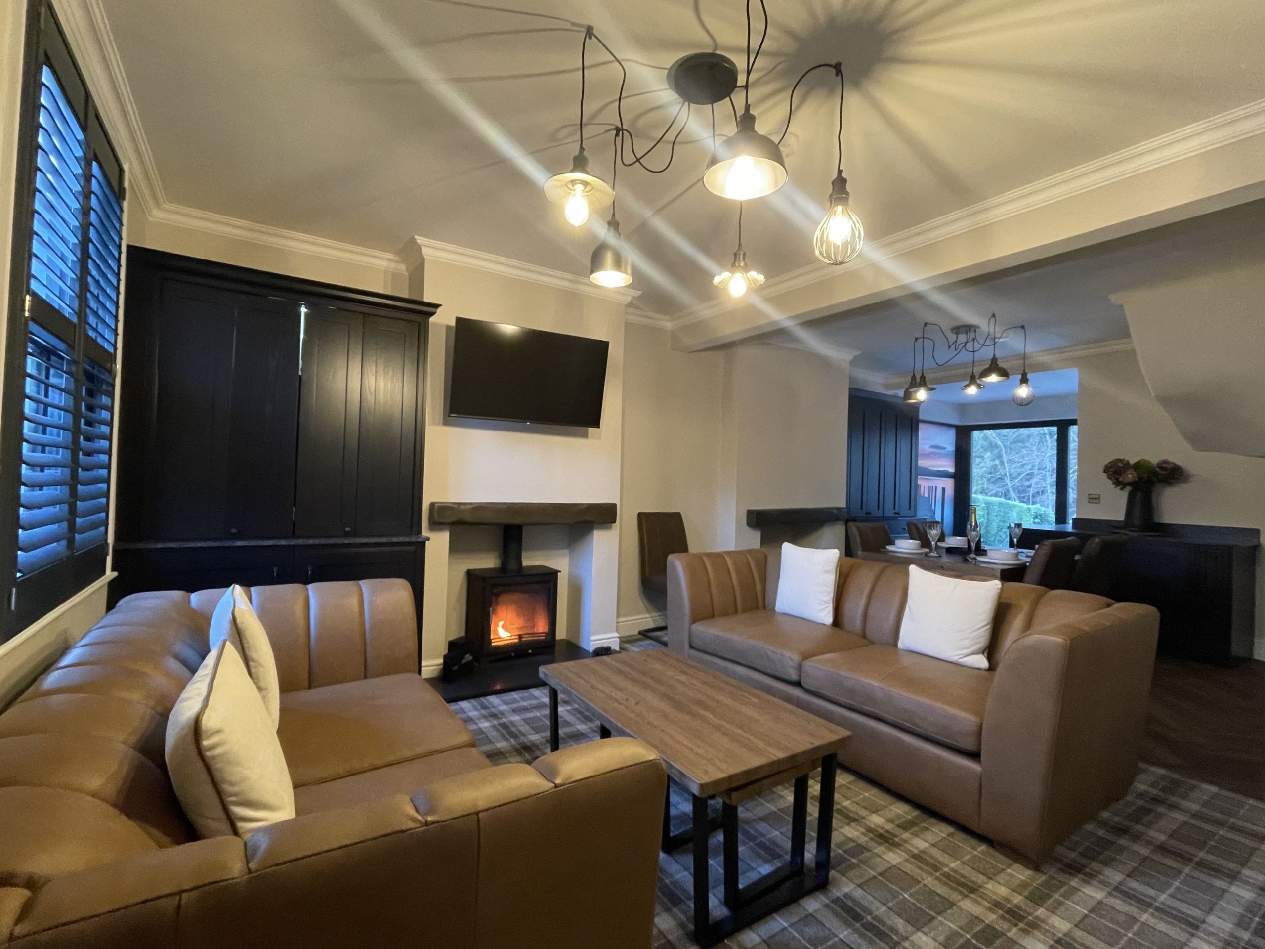  The living area is furnished with 2 plush leather sofas