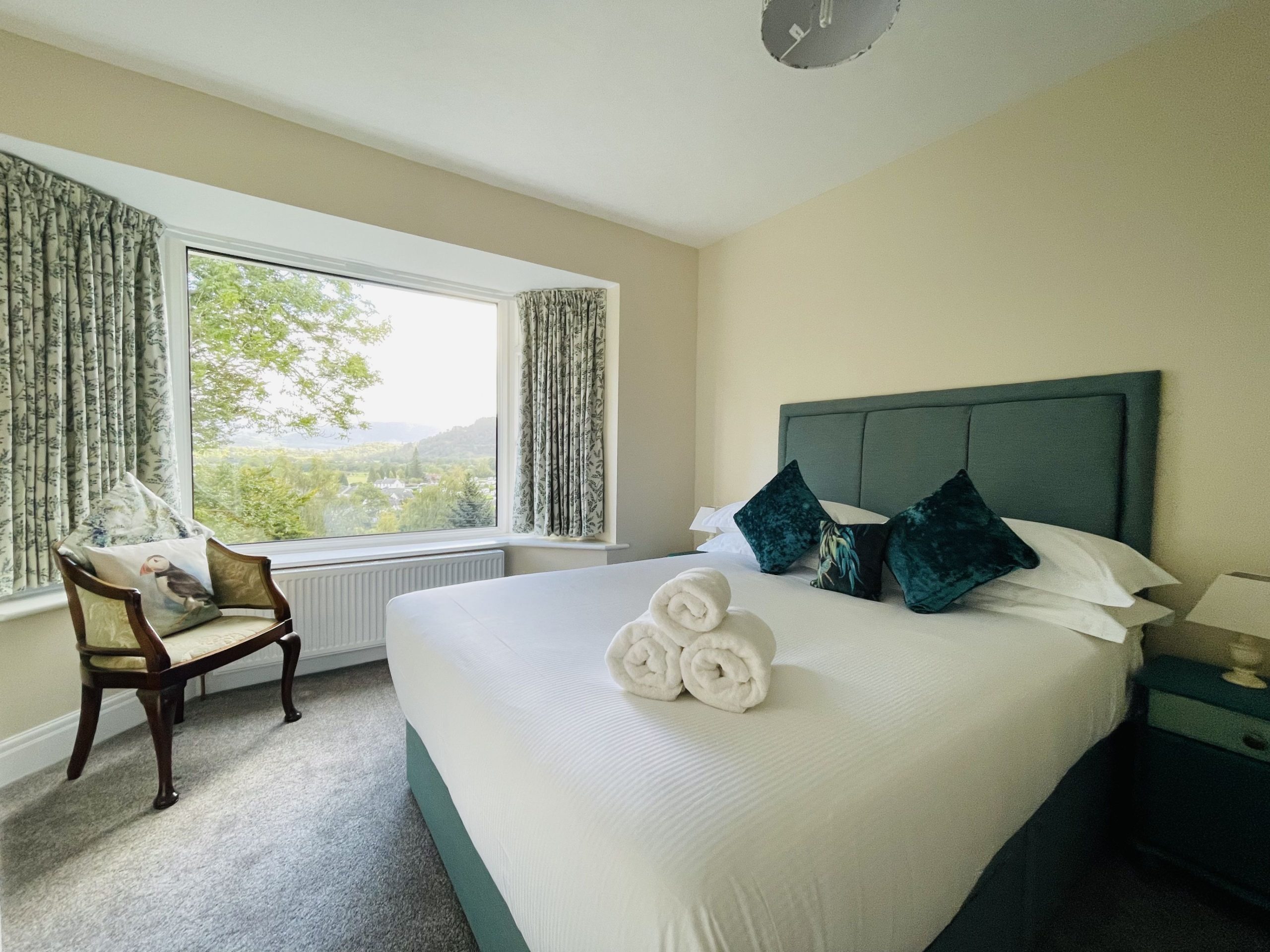 The master bedroom at the front of the property enjoys beautiful views