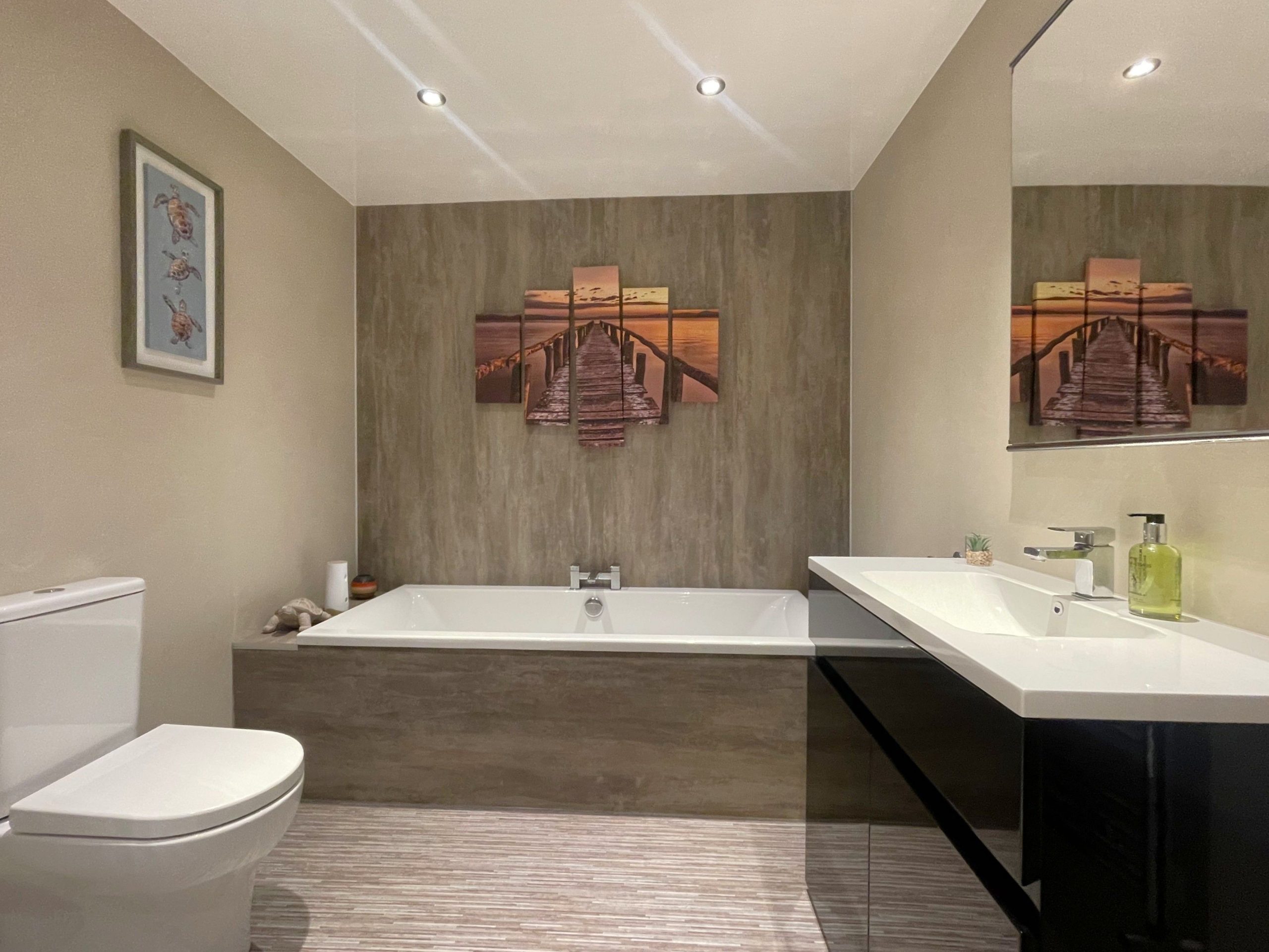 Spacious family bathroom with separate bath and shower, WC, and sink