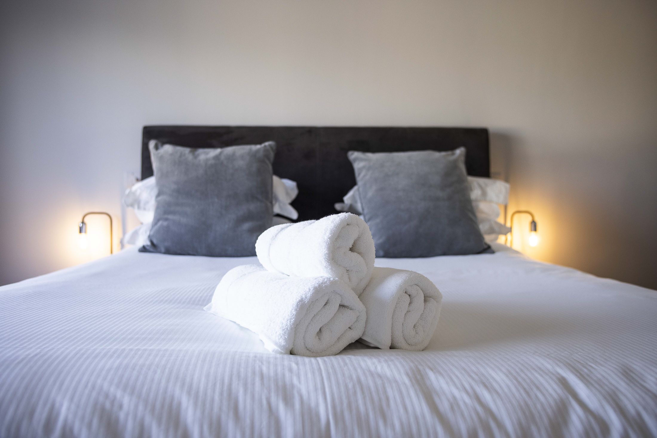 Comfy beds with fresh linens and towels provided.