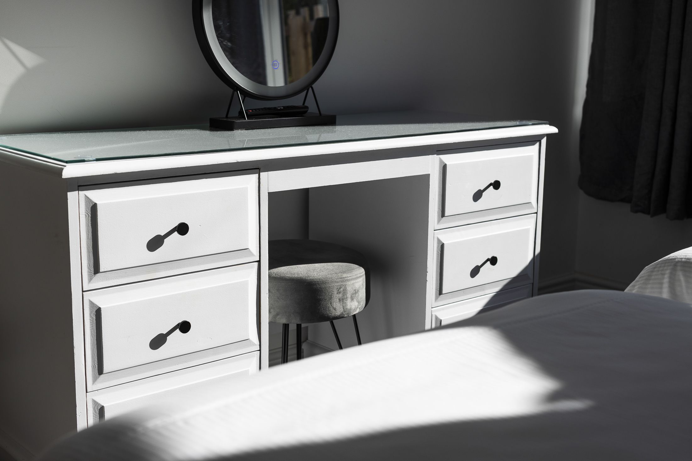 With plenty of storage for clothing, and a vanity to get ready each morning.