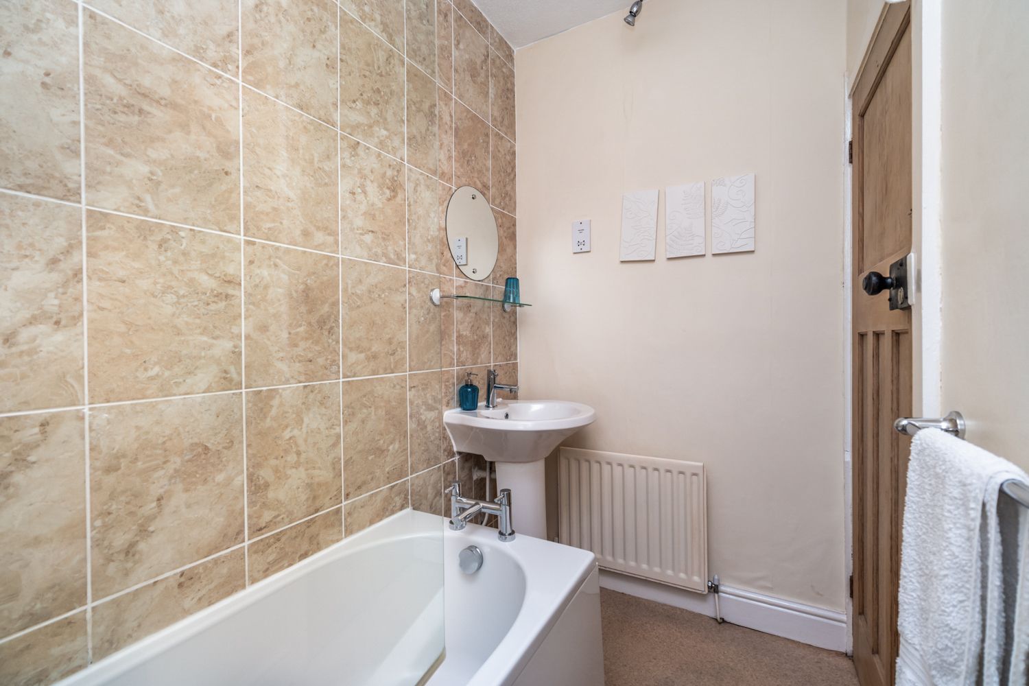 The bathroom also comprises WC, hand sink and heated towel rail