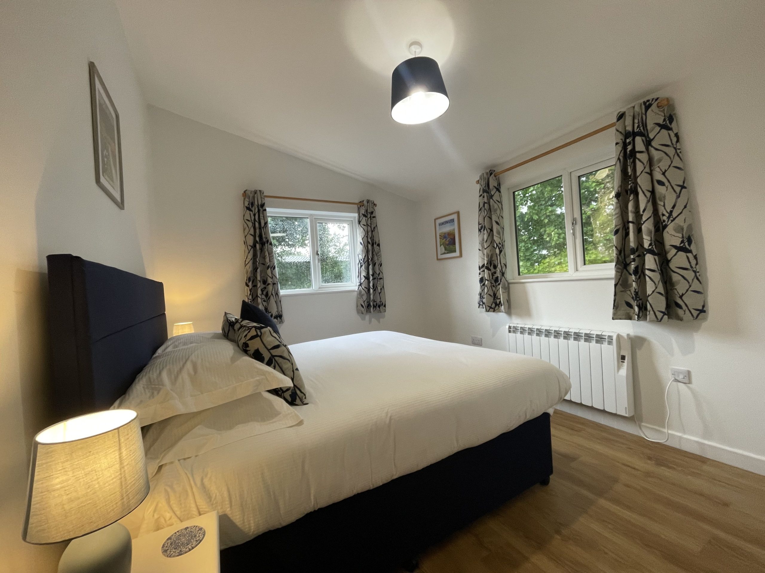 The master bedroom enjoys rear and side garden views