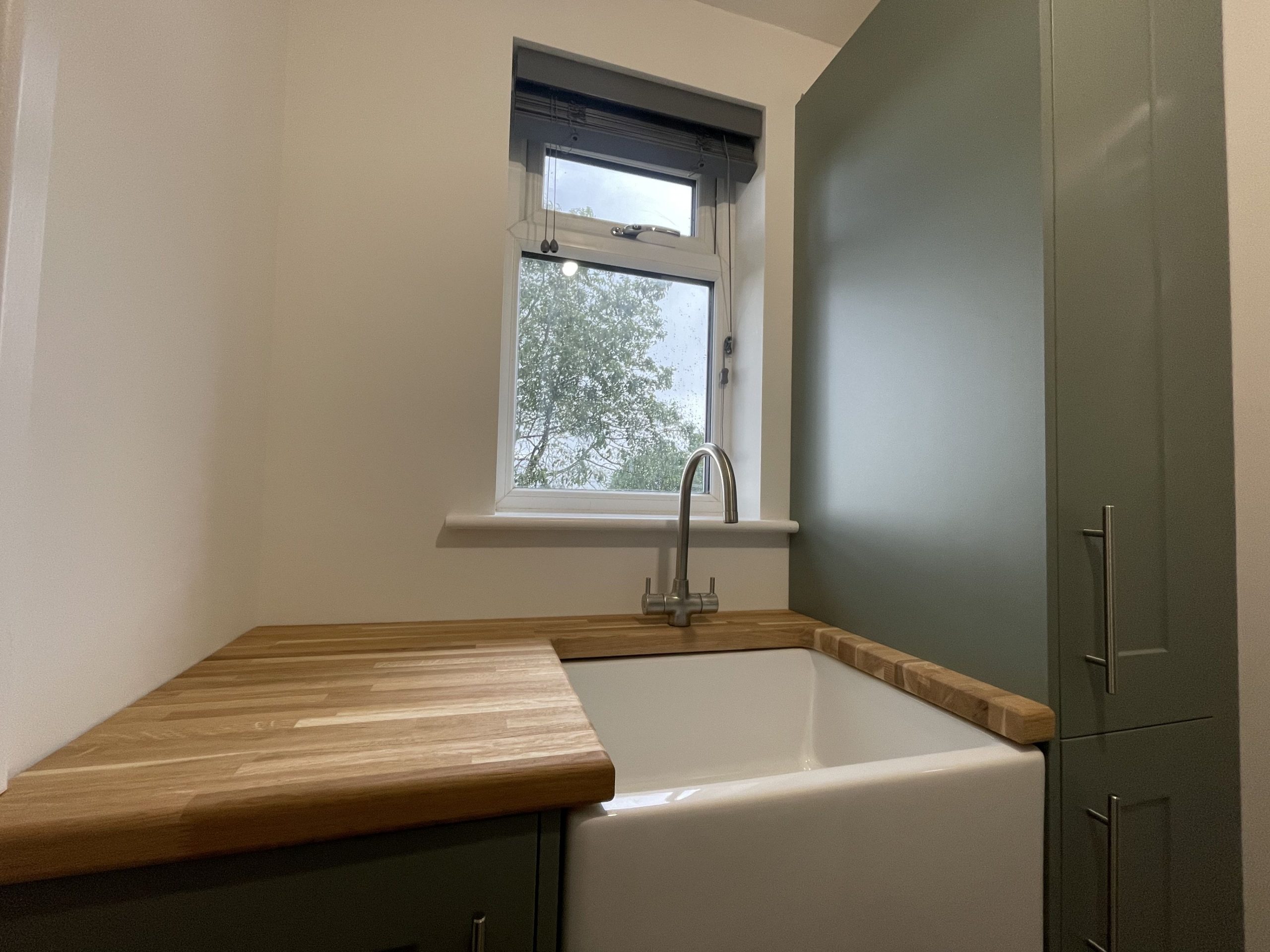 A large, handy Belfast sink in the utility area