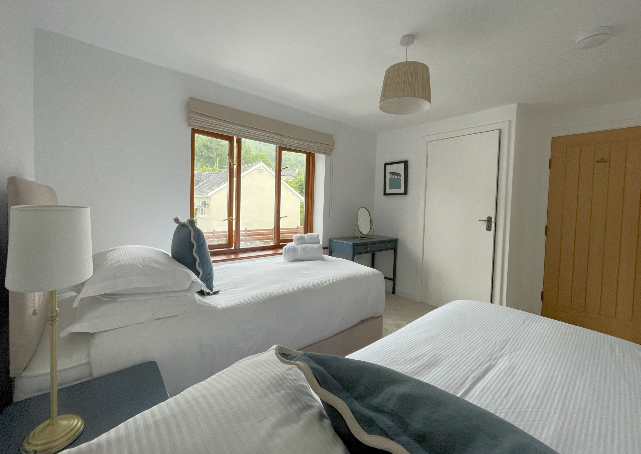 The twin bedroom with built in storage