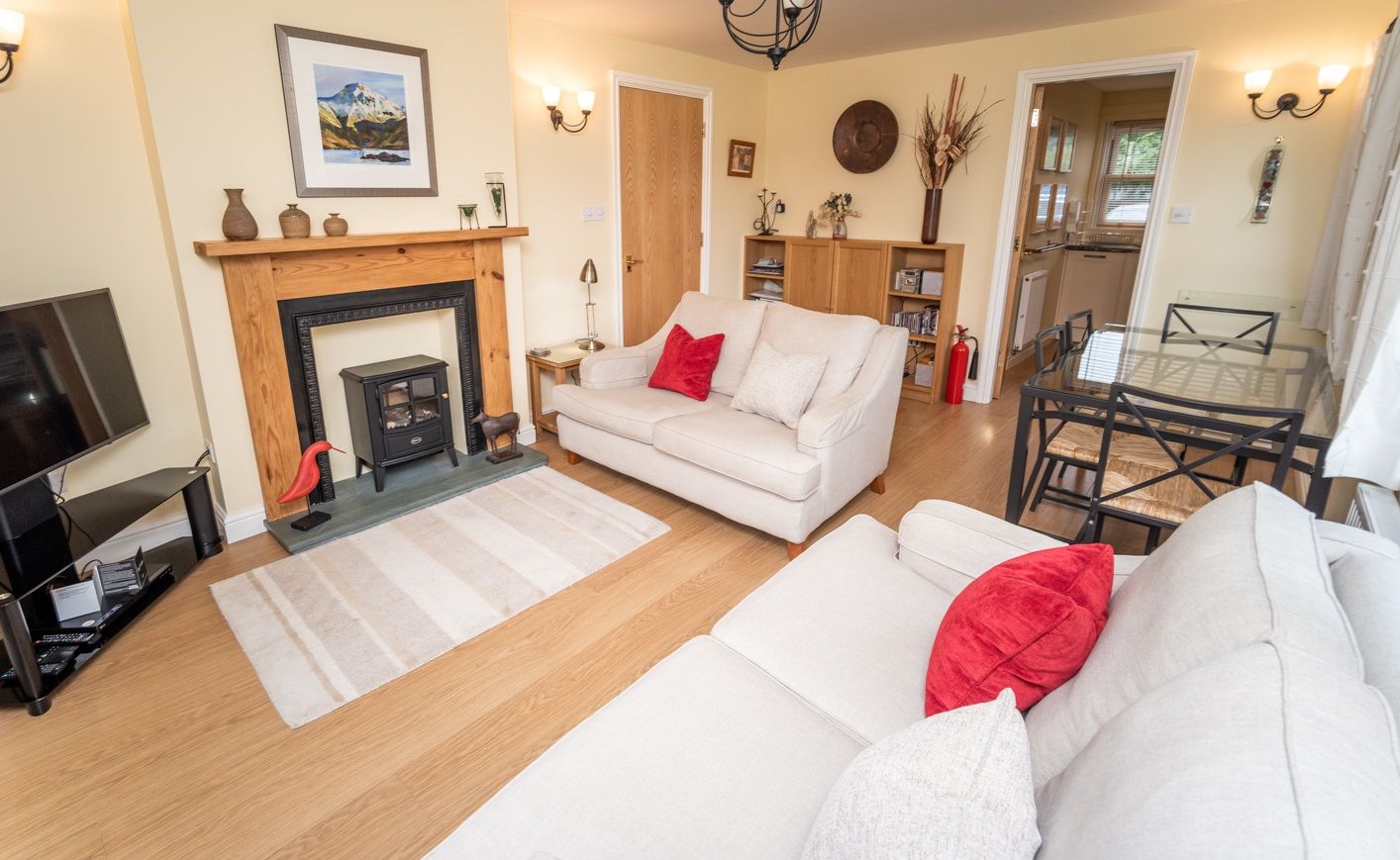 The living room features a gas fire with Lakeland slate hearth