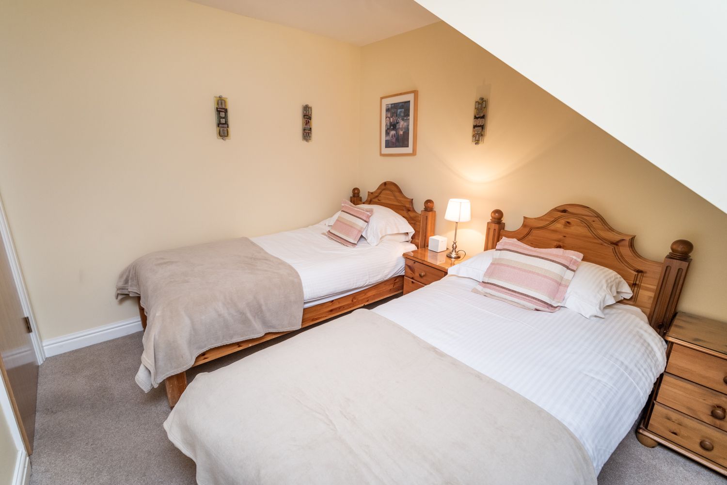 The apartment sleeps 4 people and includes a twin and a double bedroom