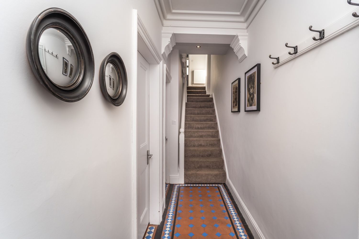 The front entrance leads into an impressive hallway, from which you can access the kitchen and ground floor bedroom