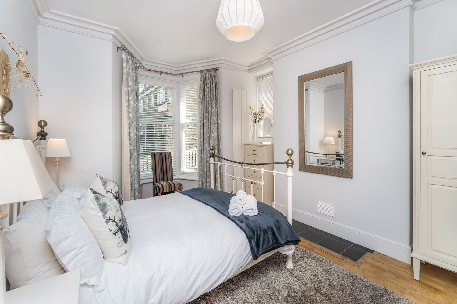 The ground floor bedroom is spacious, with enough room for a travel cot if required