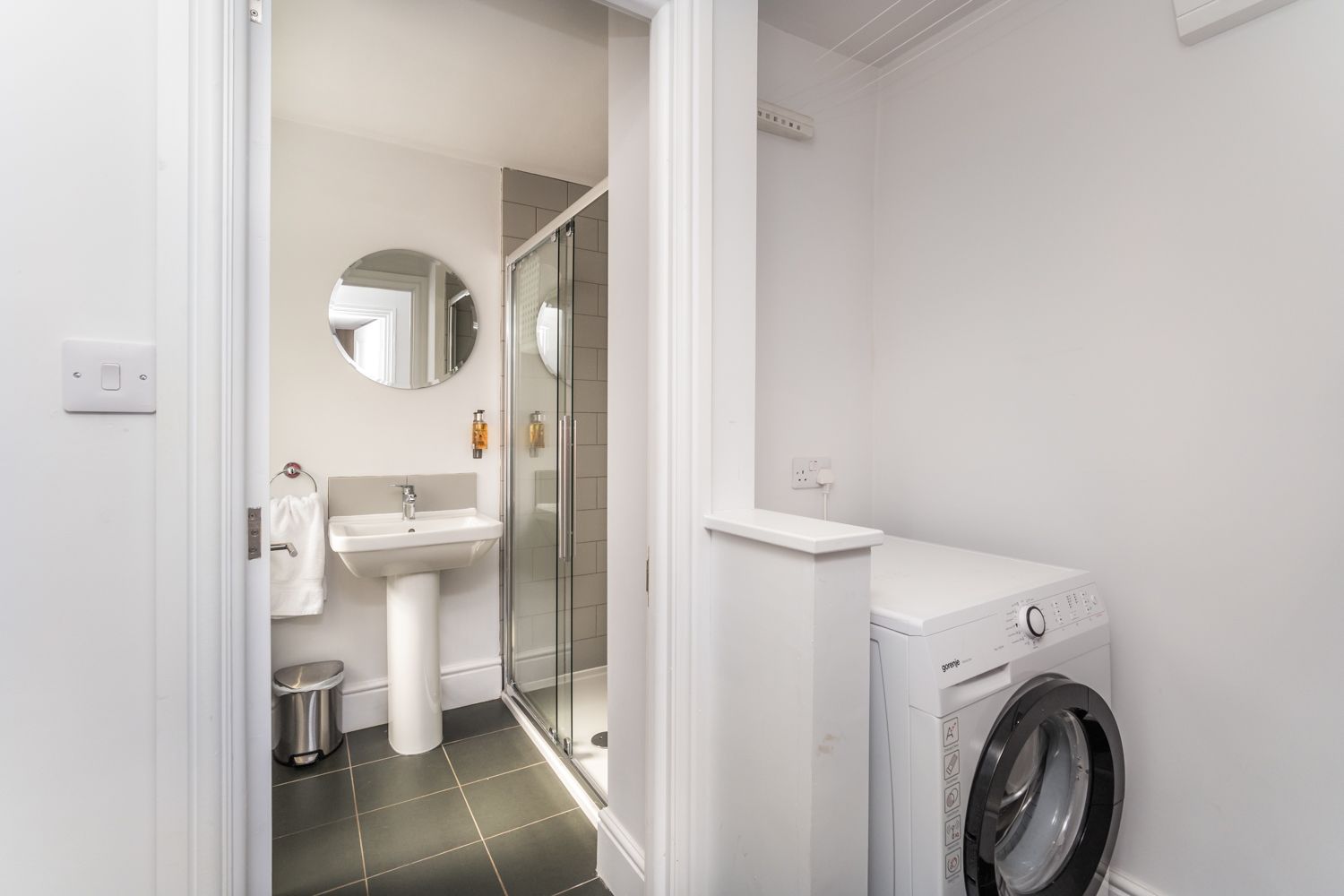 From the kitchen you can access the rear hallway, which houses the washer drier, and downstairs shower room