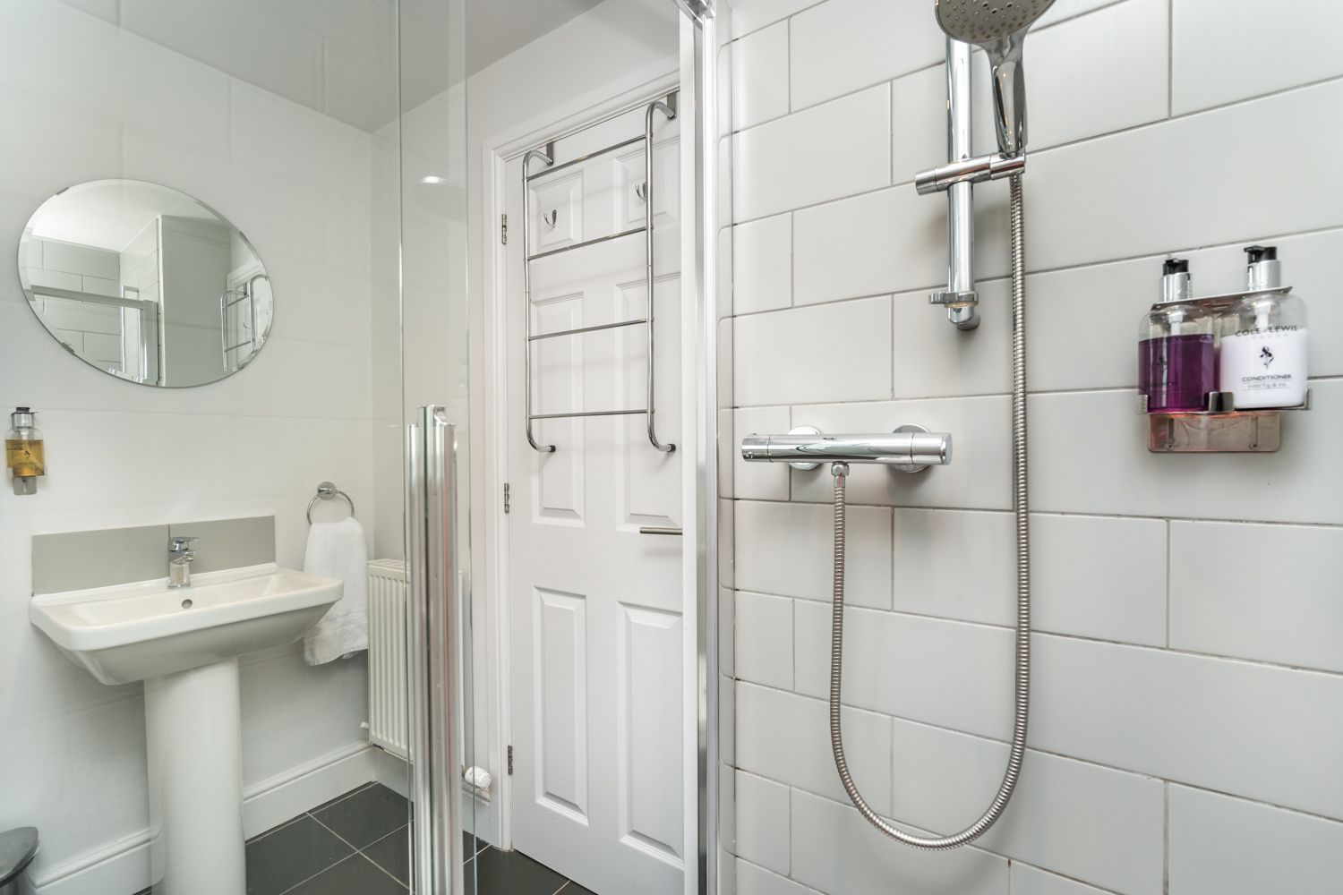 The downstairs washroom comprises walk in shower, WC and hand basin