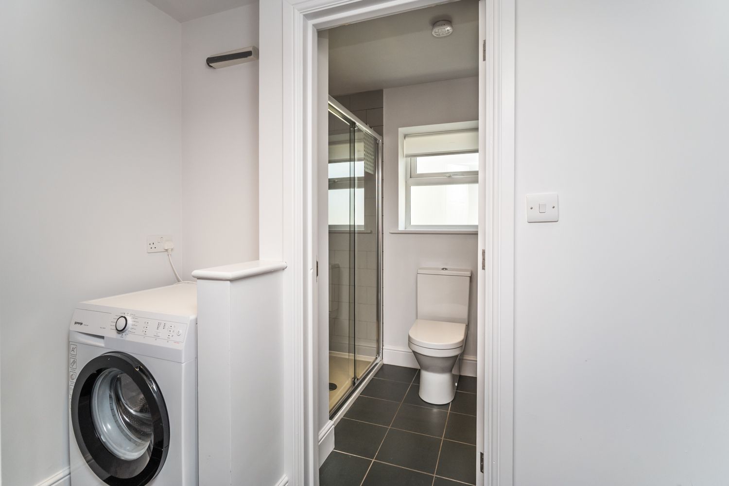 Access to the ground floor shower room is via the kitchen and hallway, where you will also find the washing machine