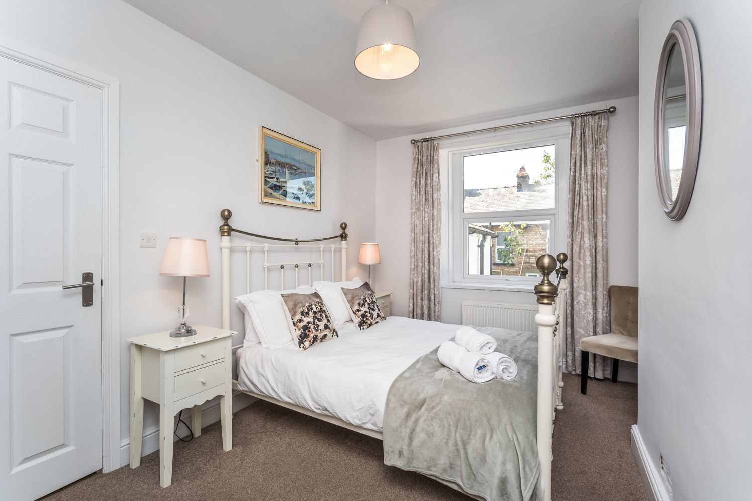 The first floor bedroom has a double bed, wardrobe, drawers and bedside tables