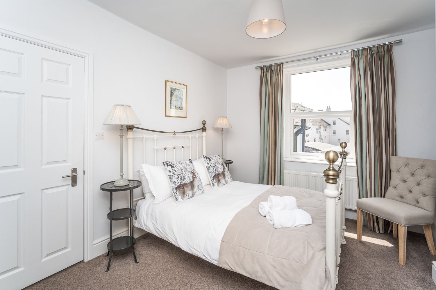 The second bedroom is on the 1st floor at the rear of the property