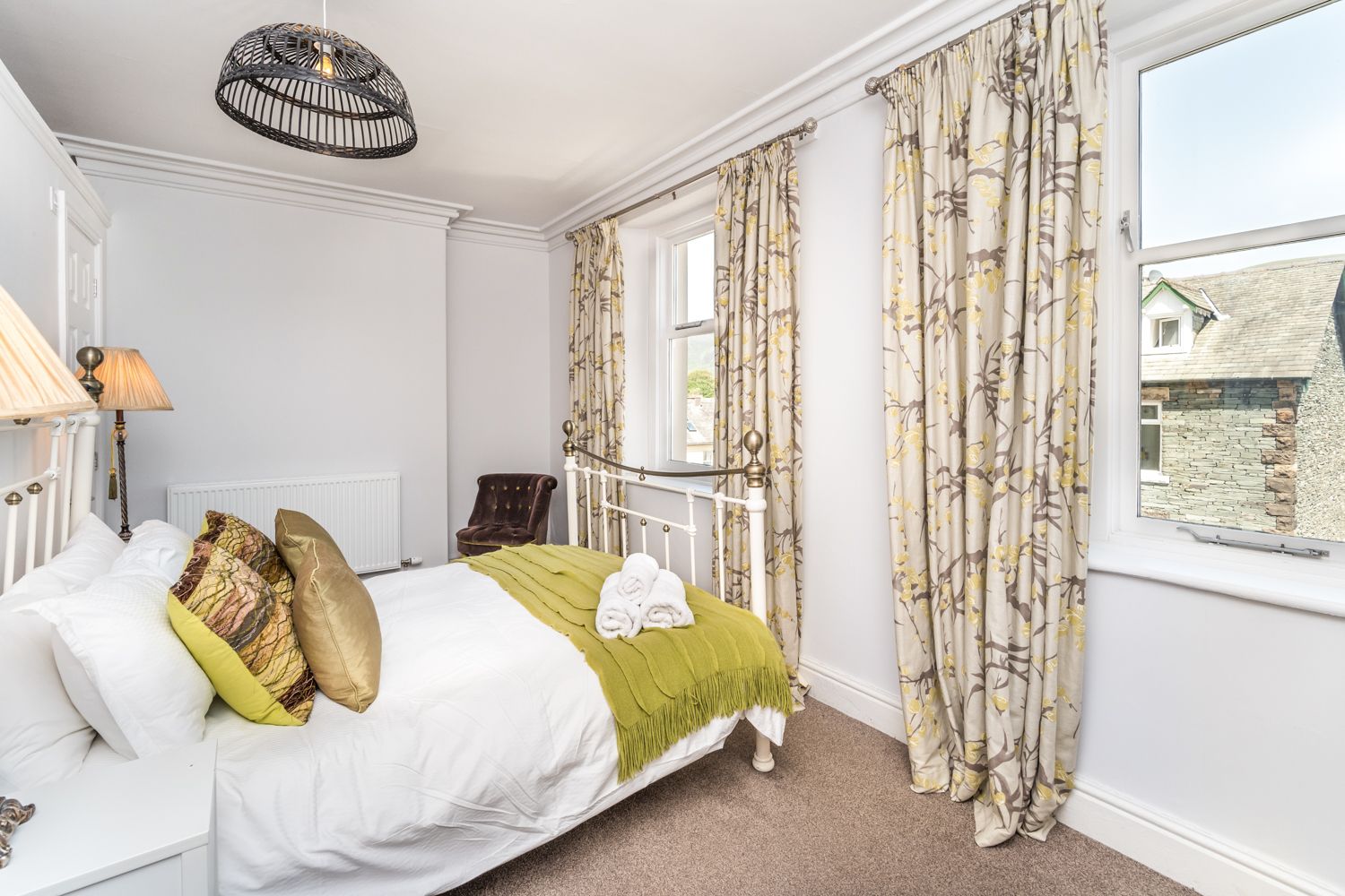 This room is furnished with king sized bed, dressing table and and bedside tables, there is also a built in closet