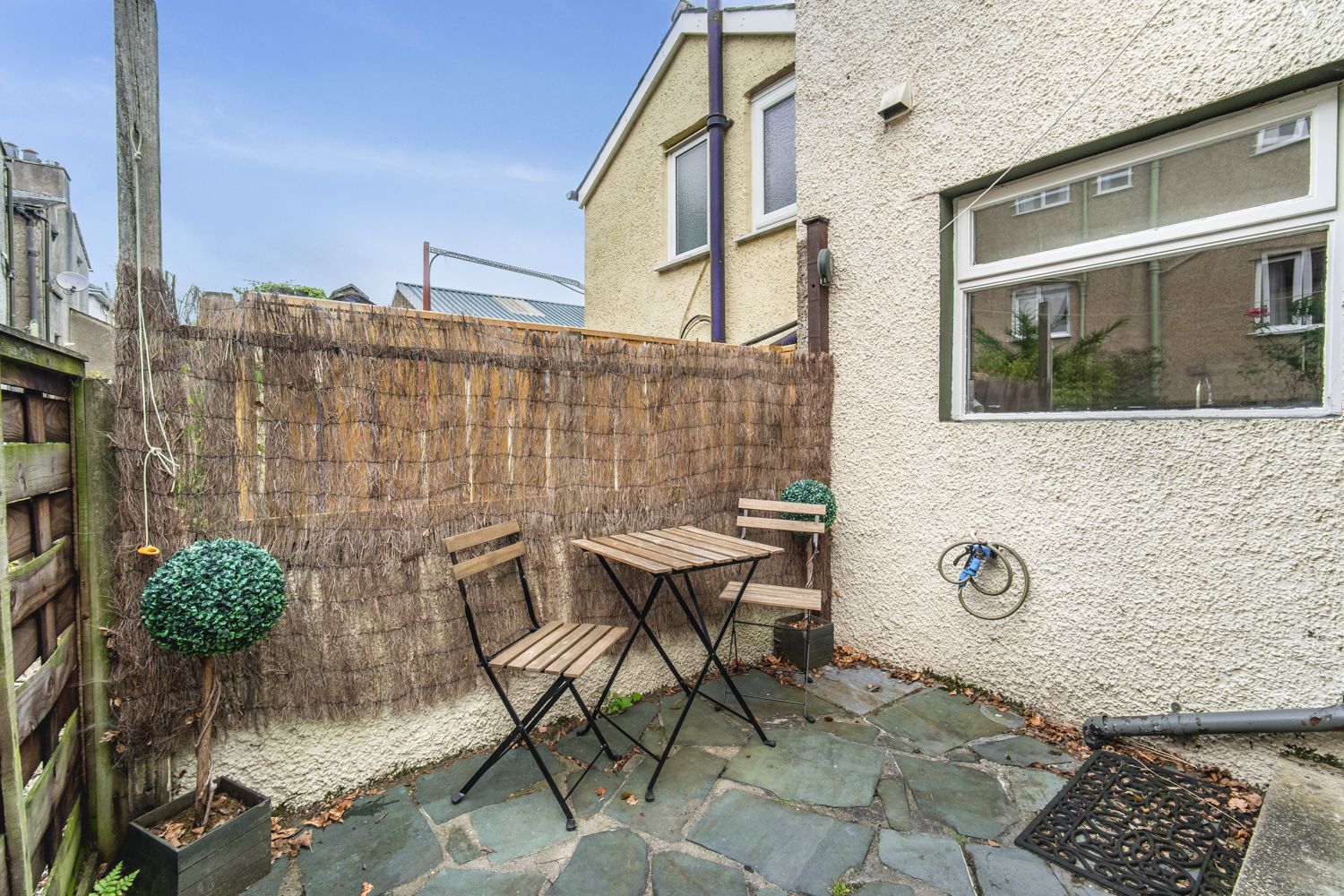 A small enclosed yard can be found at the rear of the property