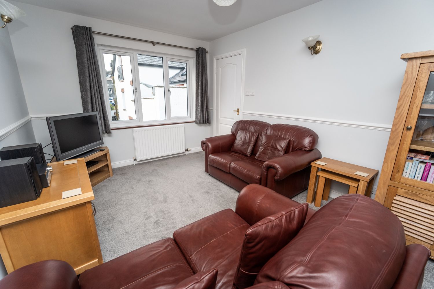 Relax in the leather settees after a day adventuring in Keswick