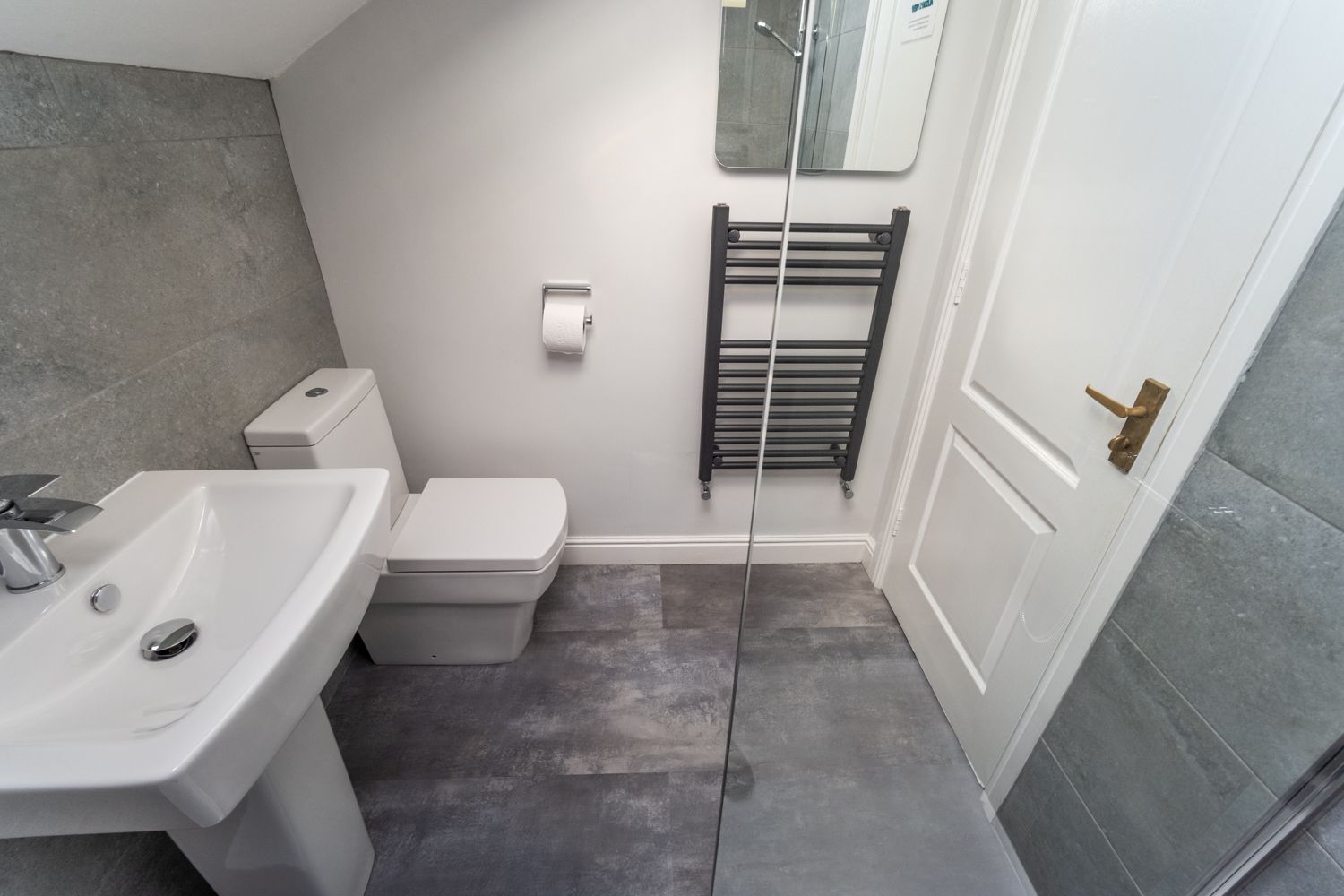 A modern bathroom with lots of lighting