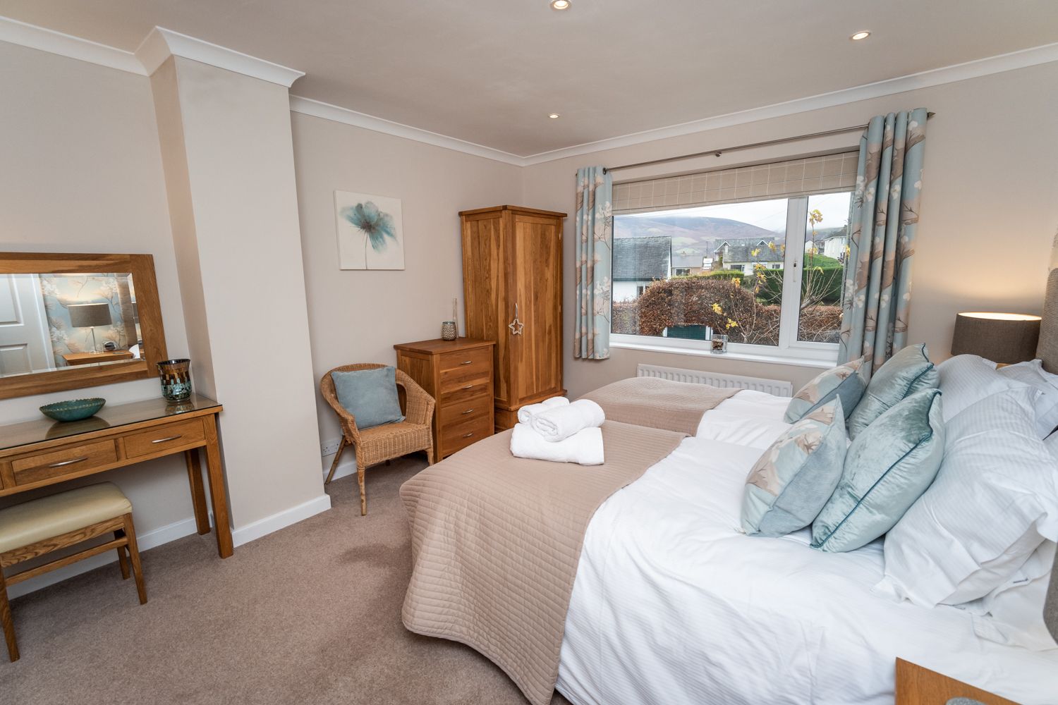 The twin bedroom is spacious and has ample storage