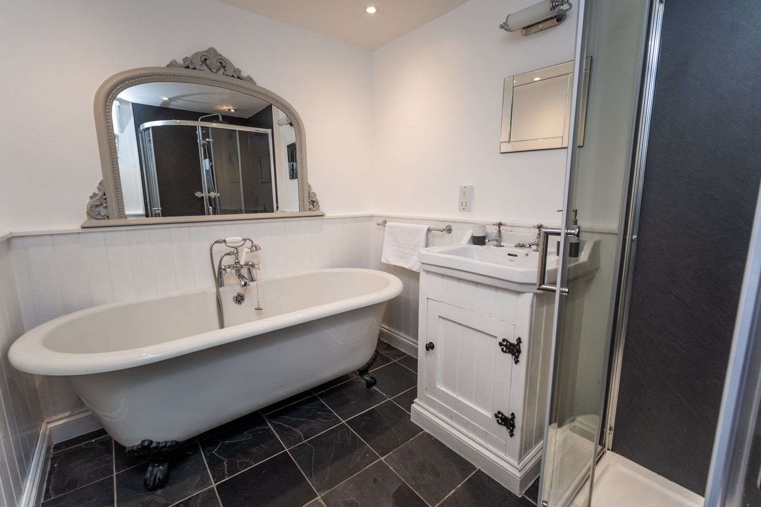 Enjoy a soak in the beautiful roll top bath 