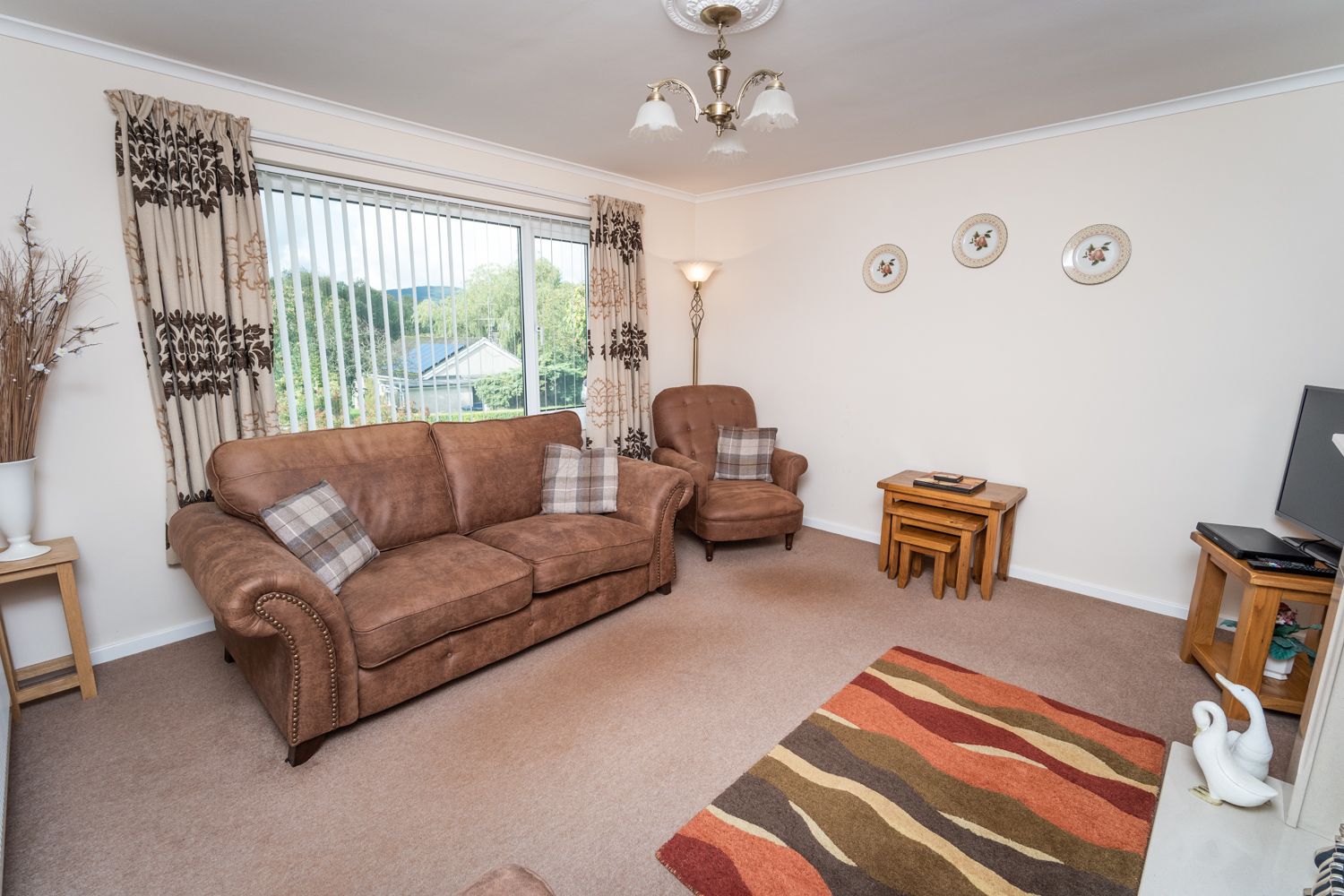 The light and airy living area is found at the front of the property