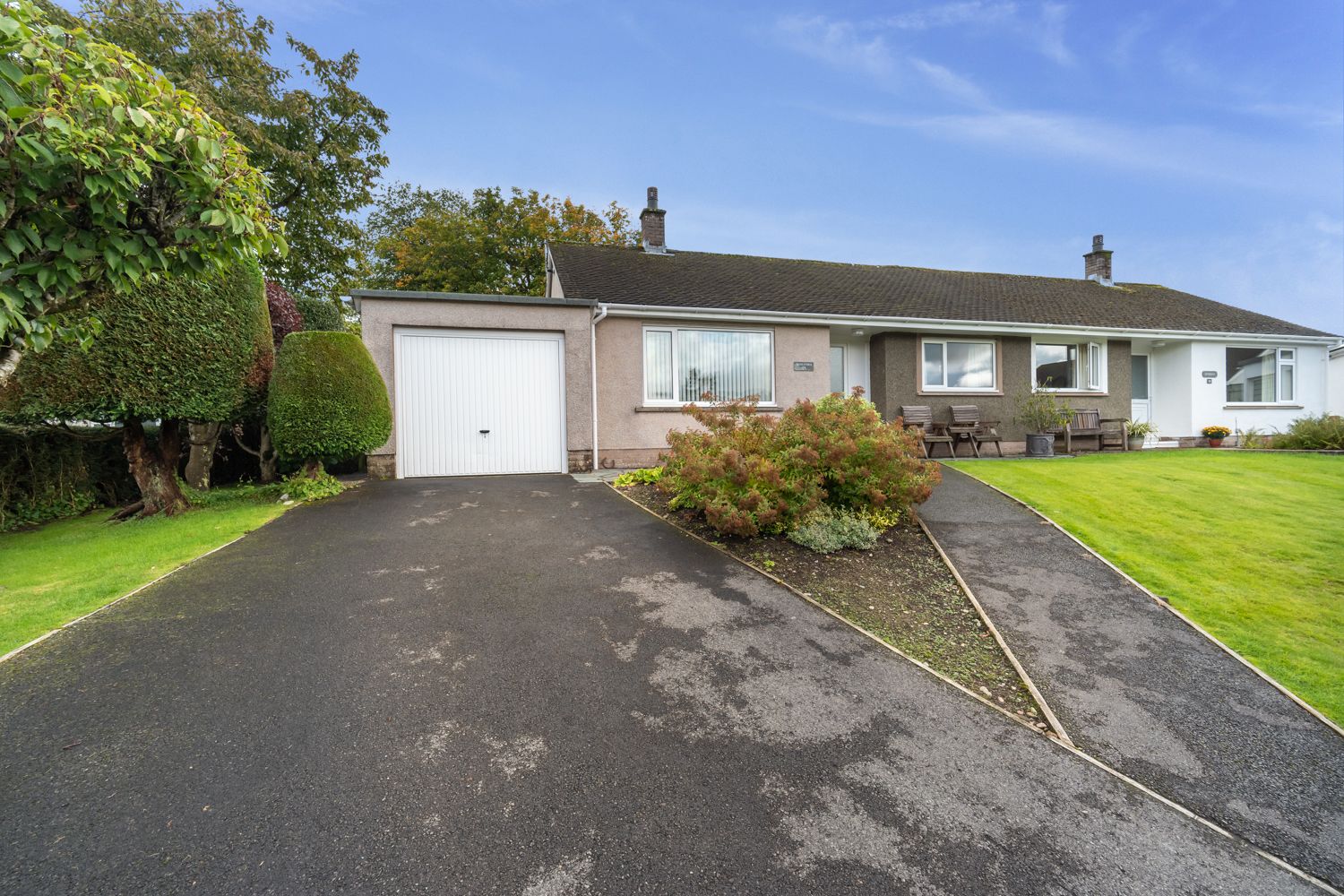 The property benefits from a private driveway and single garage