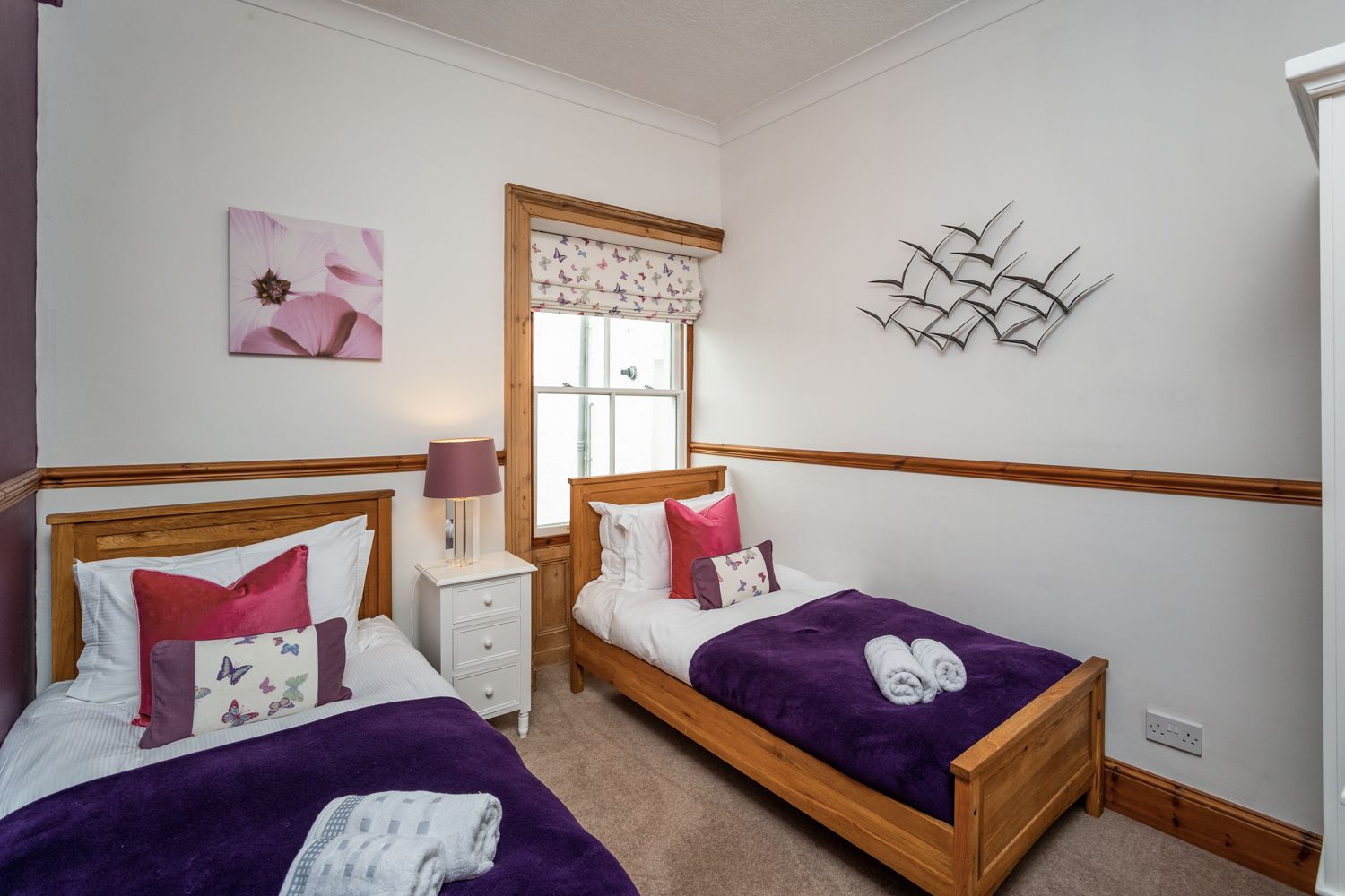 The third bedroom has two single beds 