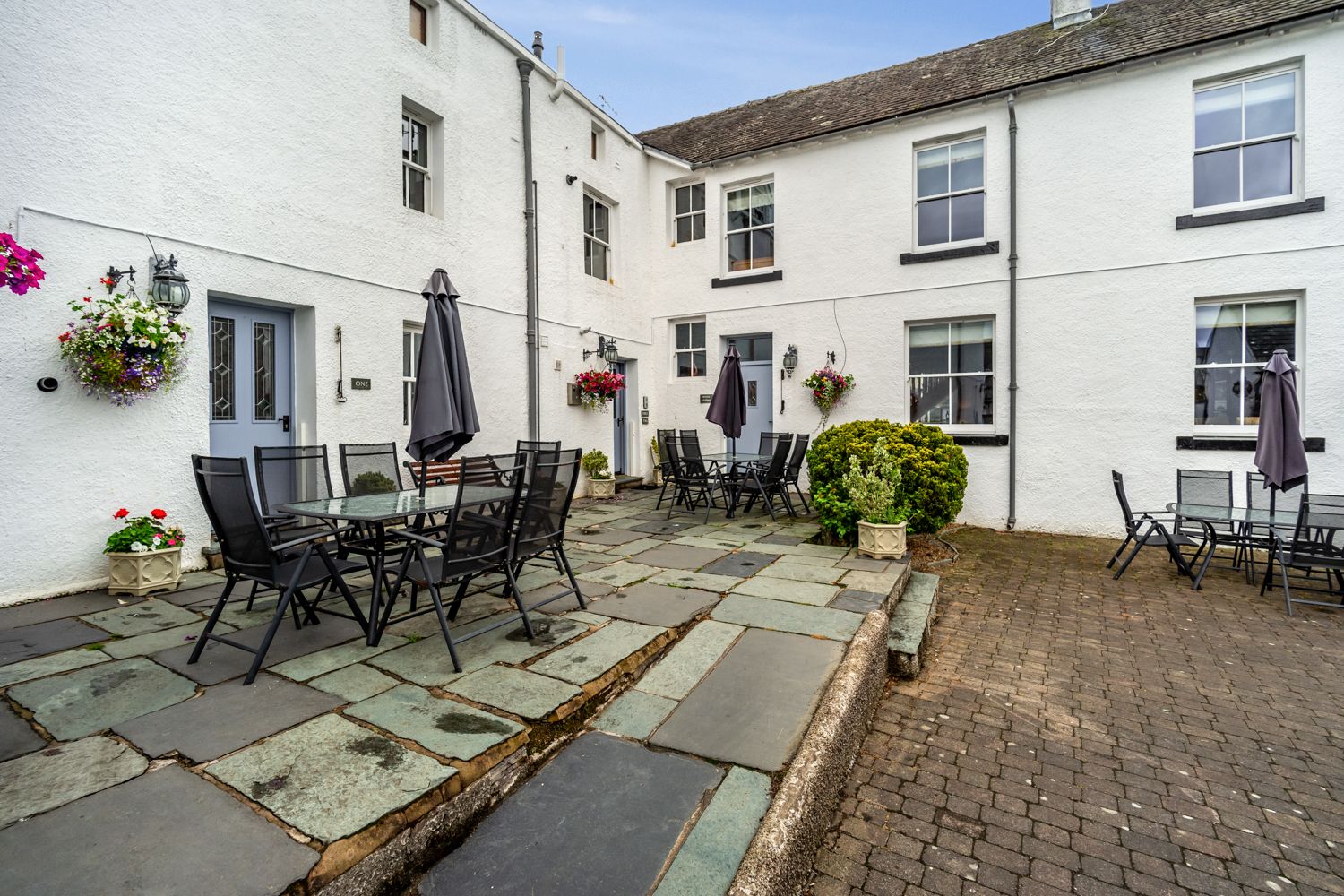 The large courtyard is shared between the Bridge complex holiday properties