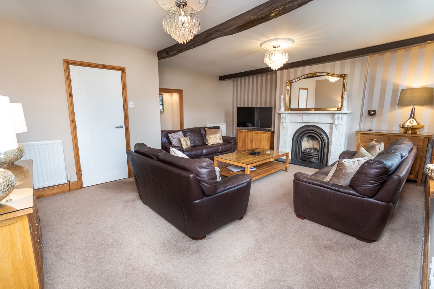 You will find original features throughout the property, like these exposed beams and the original window casings