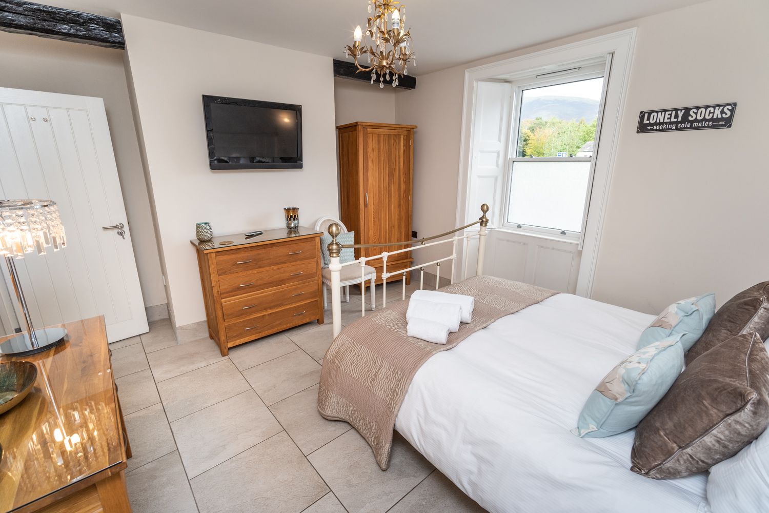 This bedroom features a king sized bed and has underfloor heating 