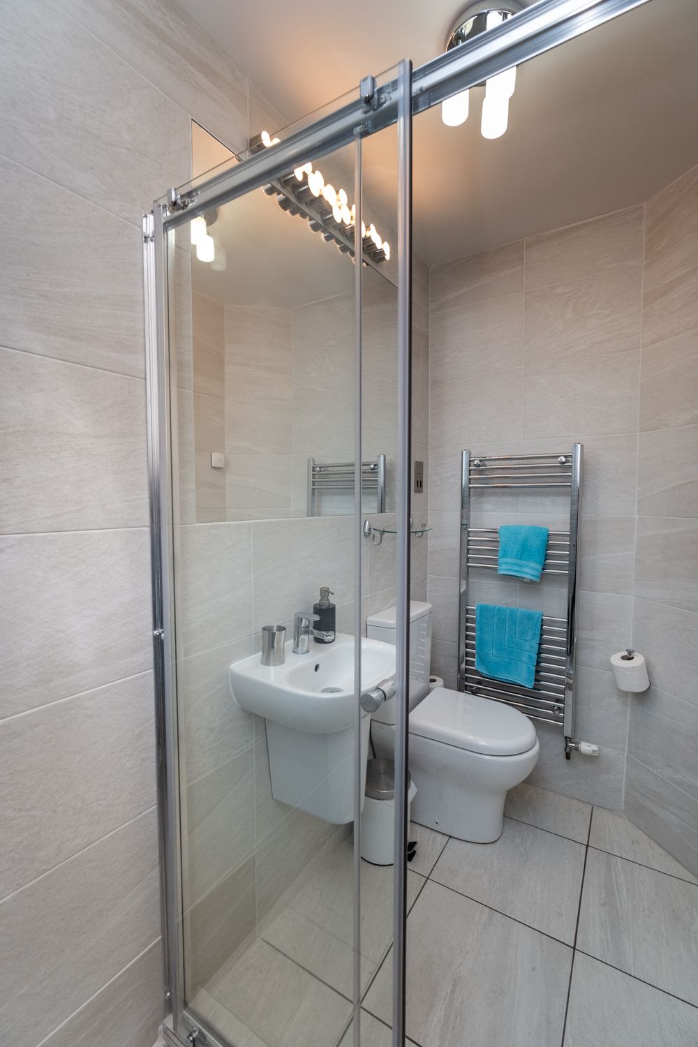 The ensuite comprises walk in shower, WC, hand basin and heated towel rail