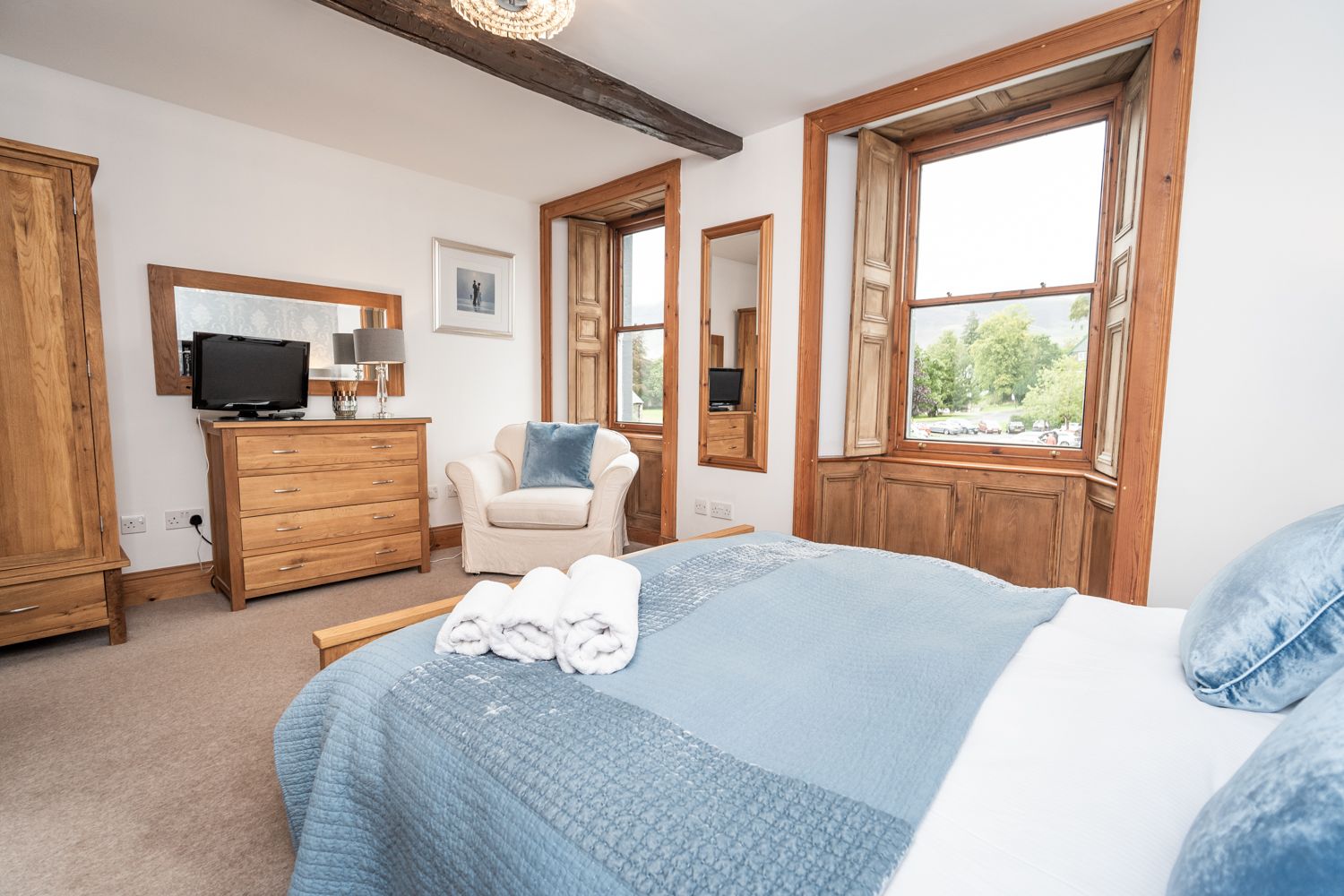 Beautiful original features are retained including the gorgeous wooden window casing and beams