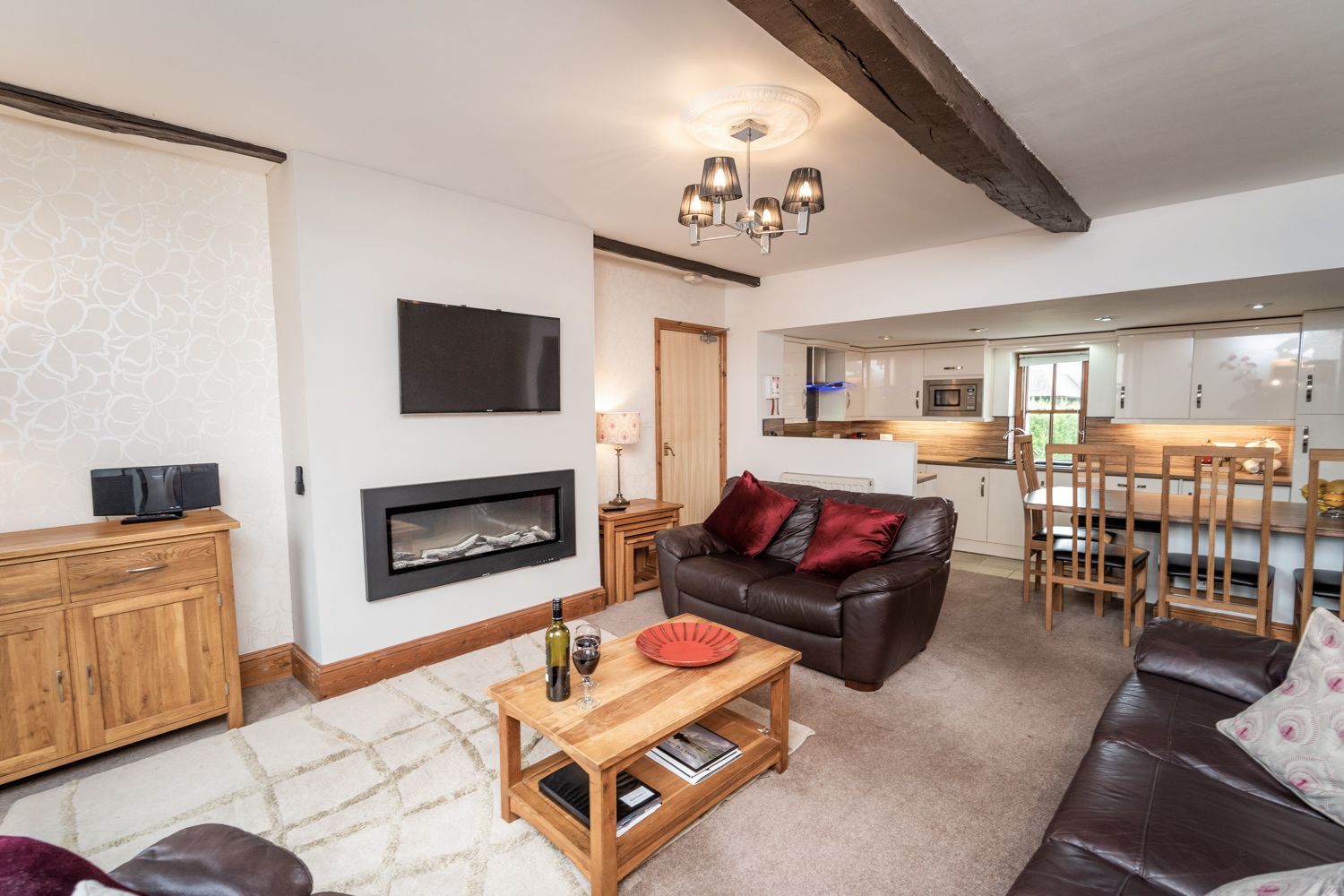 The open plan living area is modern but still retains some of the buildings original character