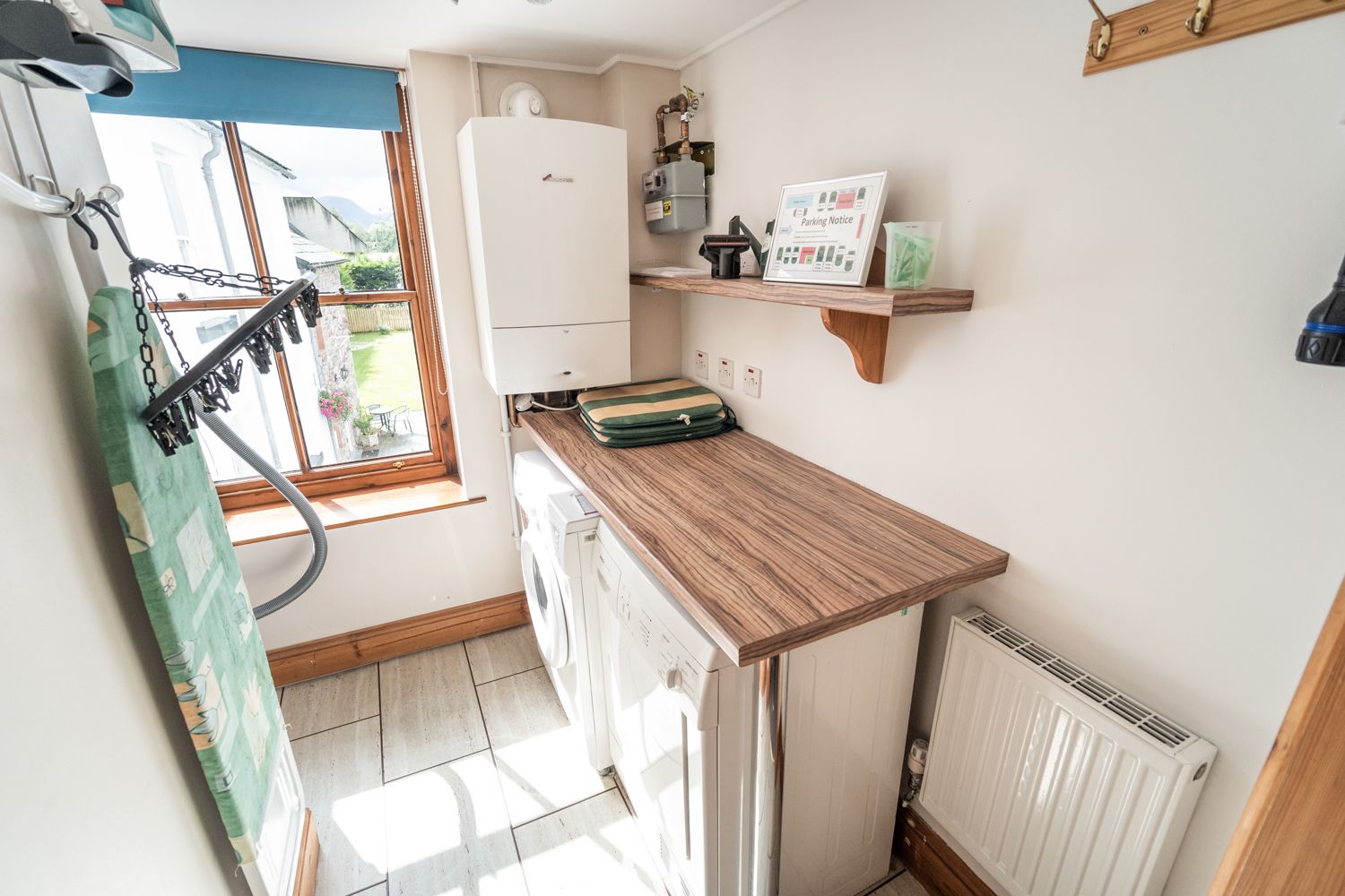 The handy utility area is spacious and comes equipped with a washer and dryer