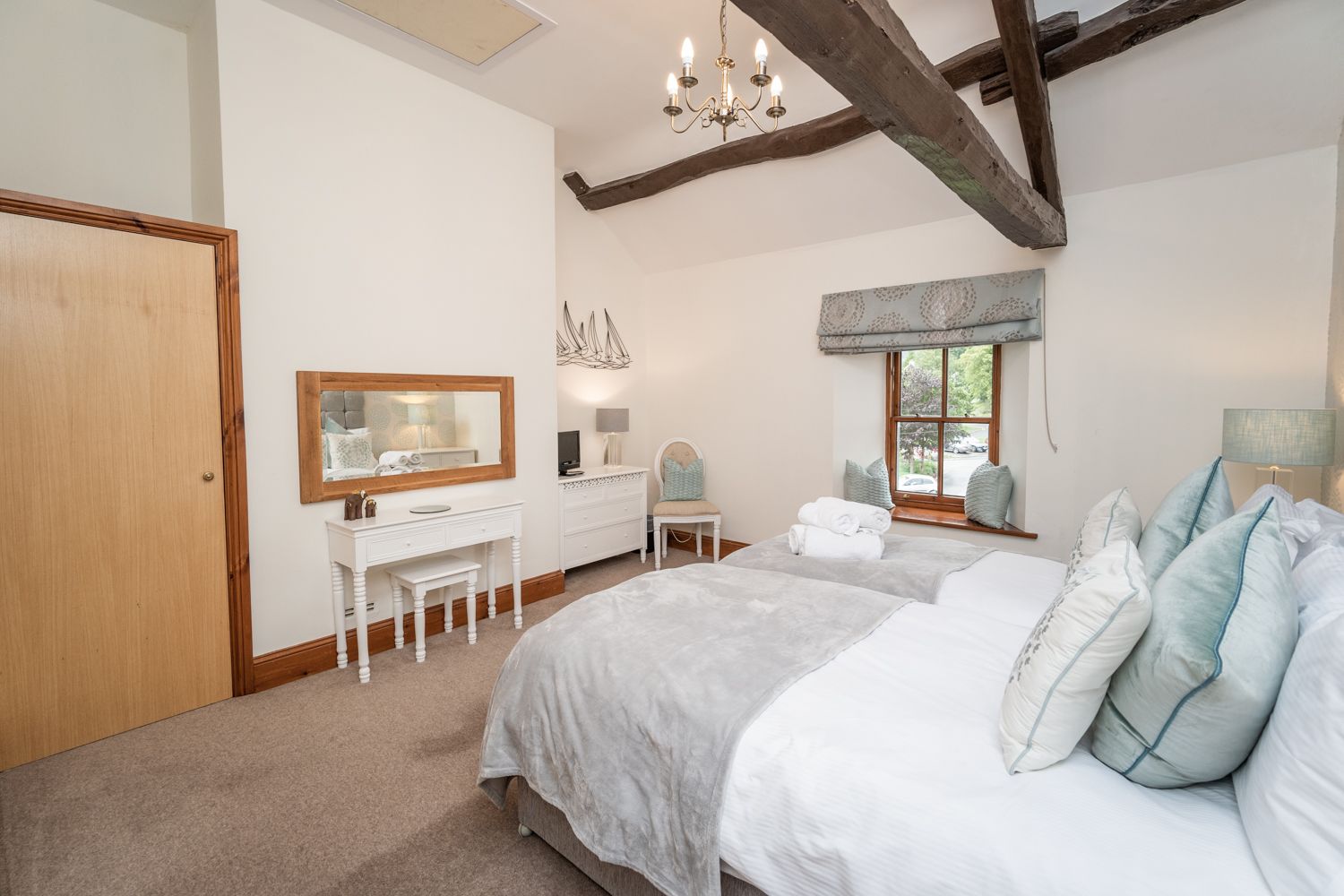 The high beamed ceiling makes this room feel very light and airy