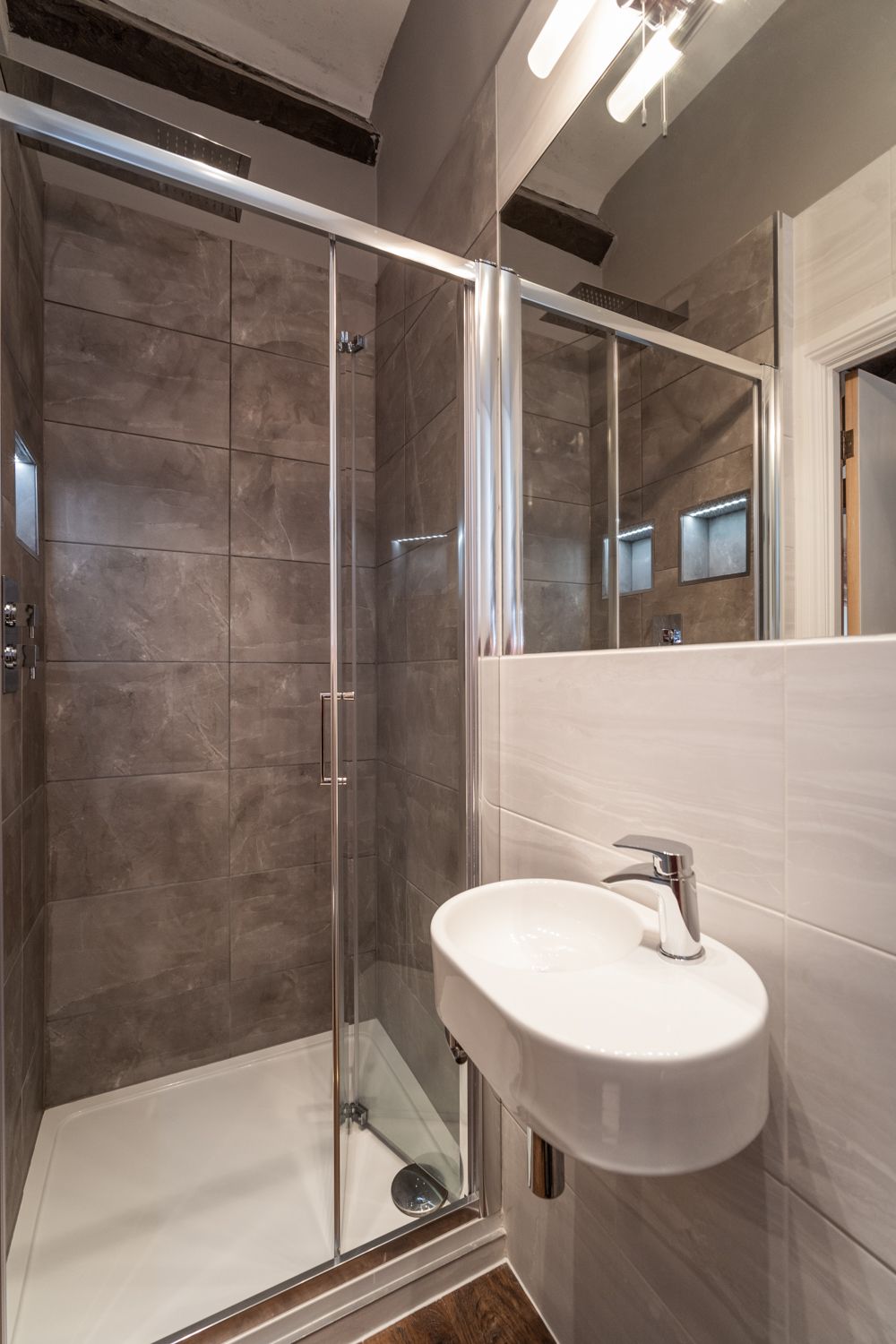 The ensuite shower room to the master bedroom has a walk in shower, WC and hand sink