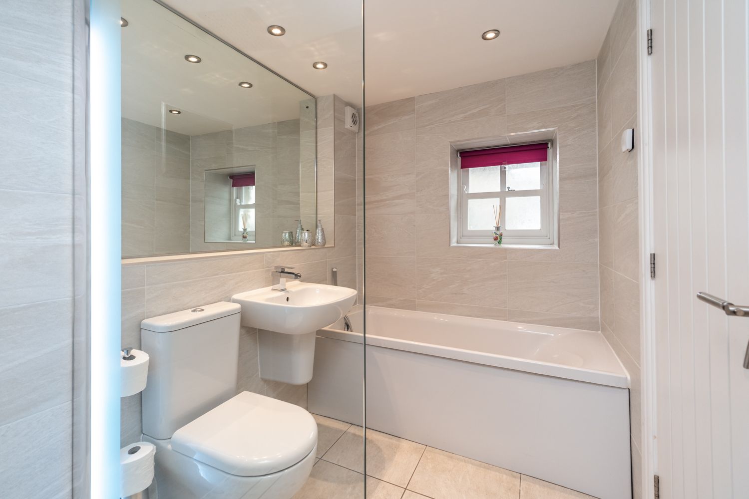 The ensuite bathroom is spacious and features a lovely bath, perfect for relaxing in after a day in the fells