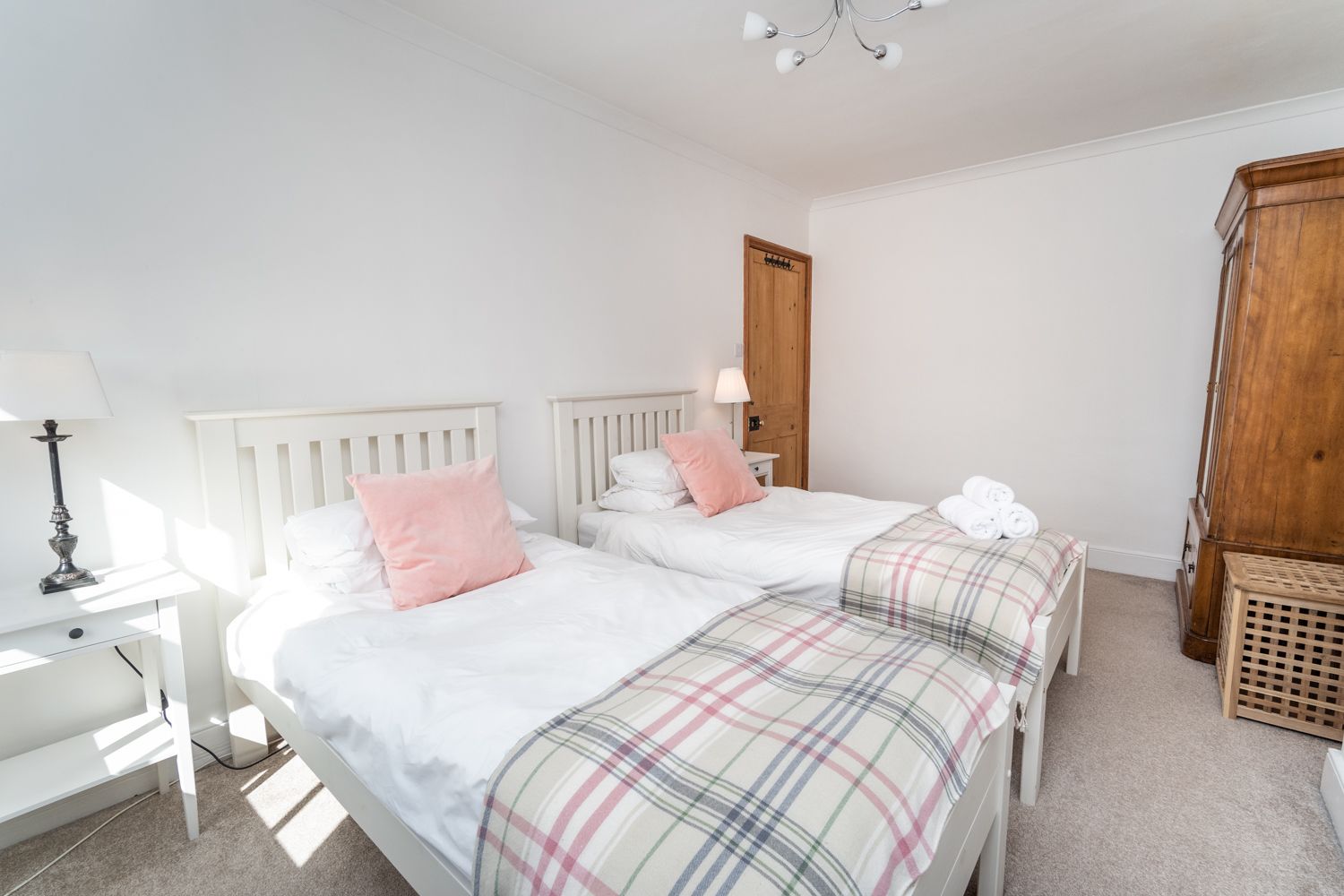 An elegantly decorated bedroom in a traditional Lakeland cottage