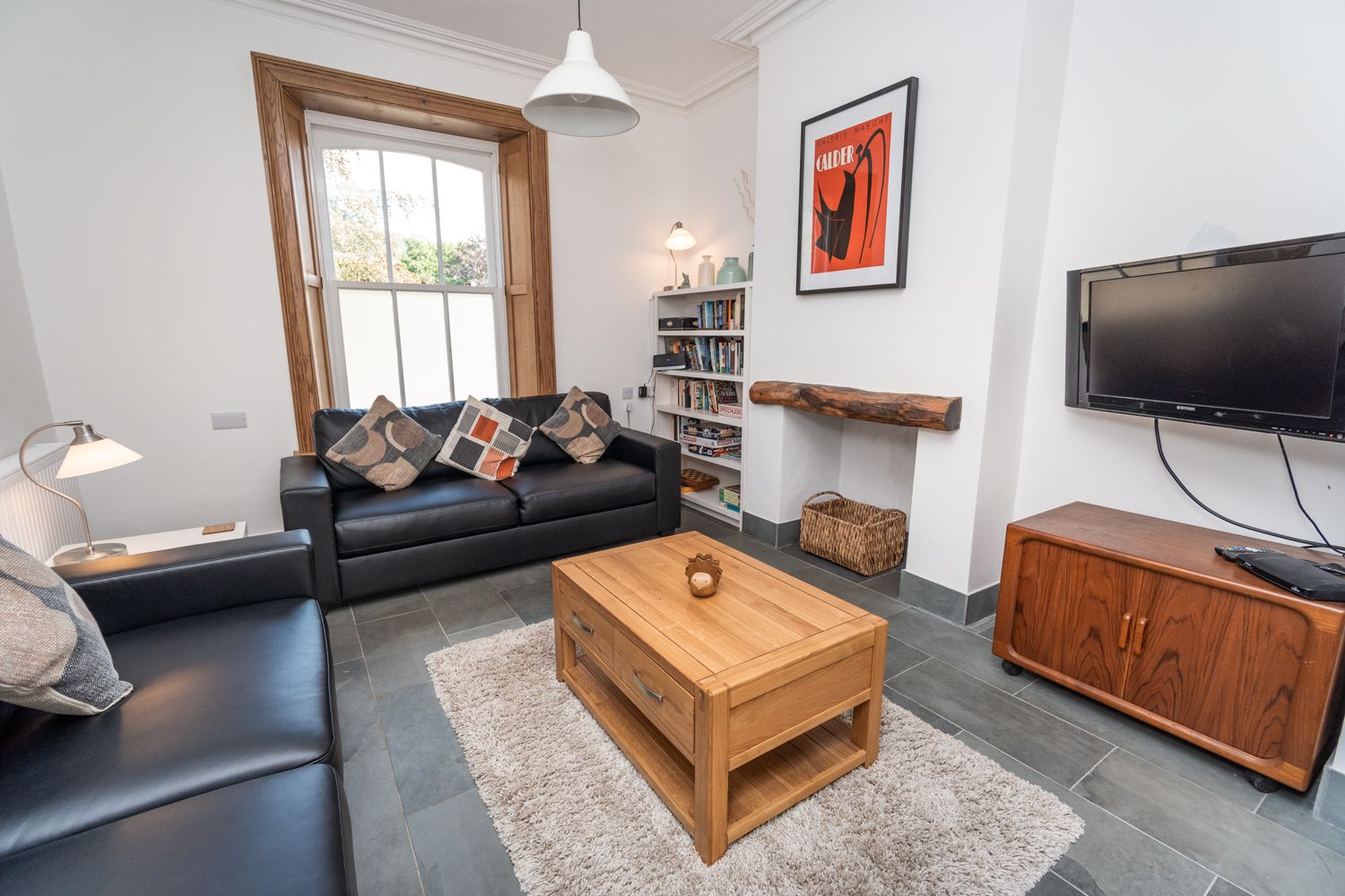 Enjoy your favourite shows in the cosy living area with wall mounted smart TV