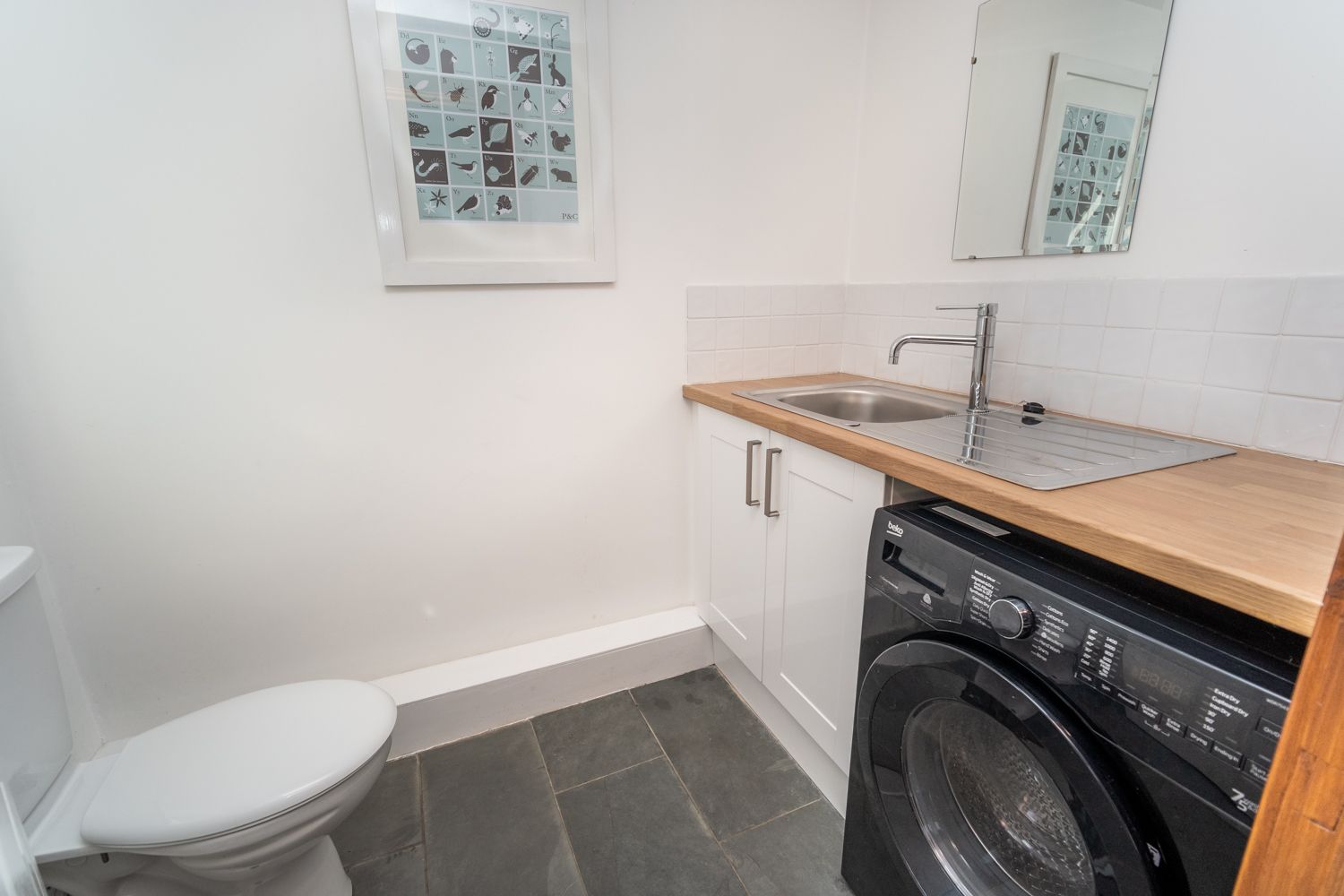 The downstairs utility/WC is accessed from the kitchen