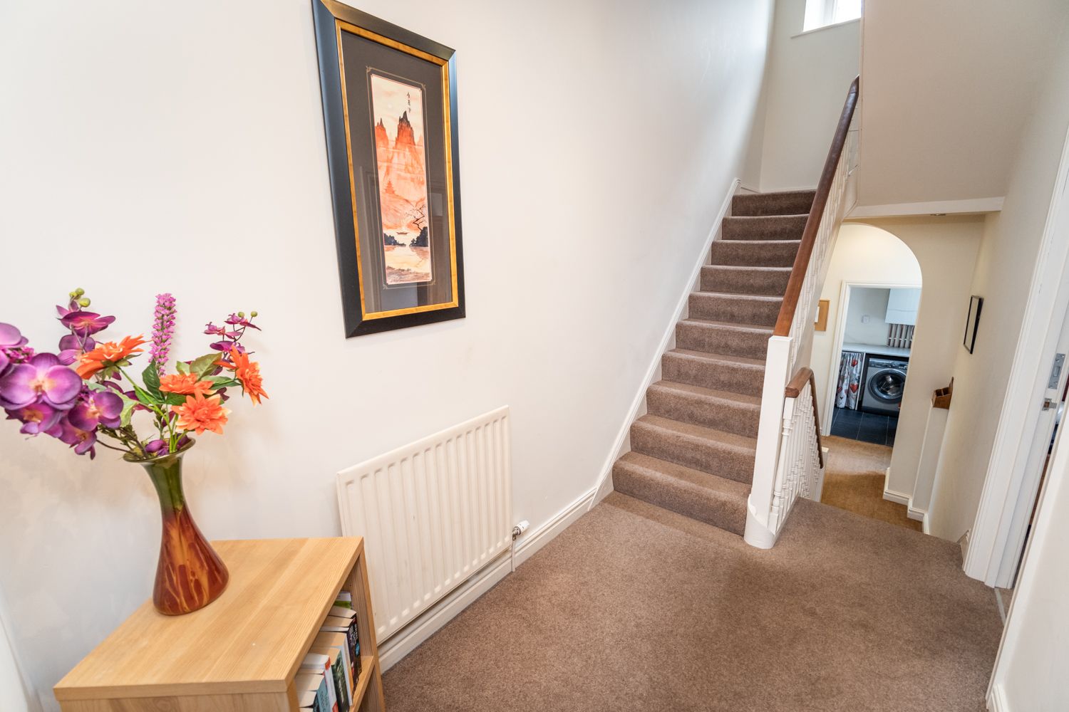 The front door opens into the hallway, from which you can access the single and 1st double bedroom, as well as the utility area and 1st floor bathroom