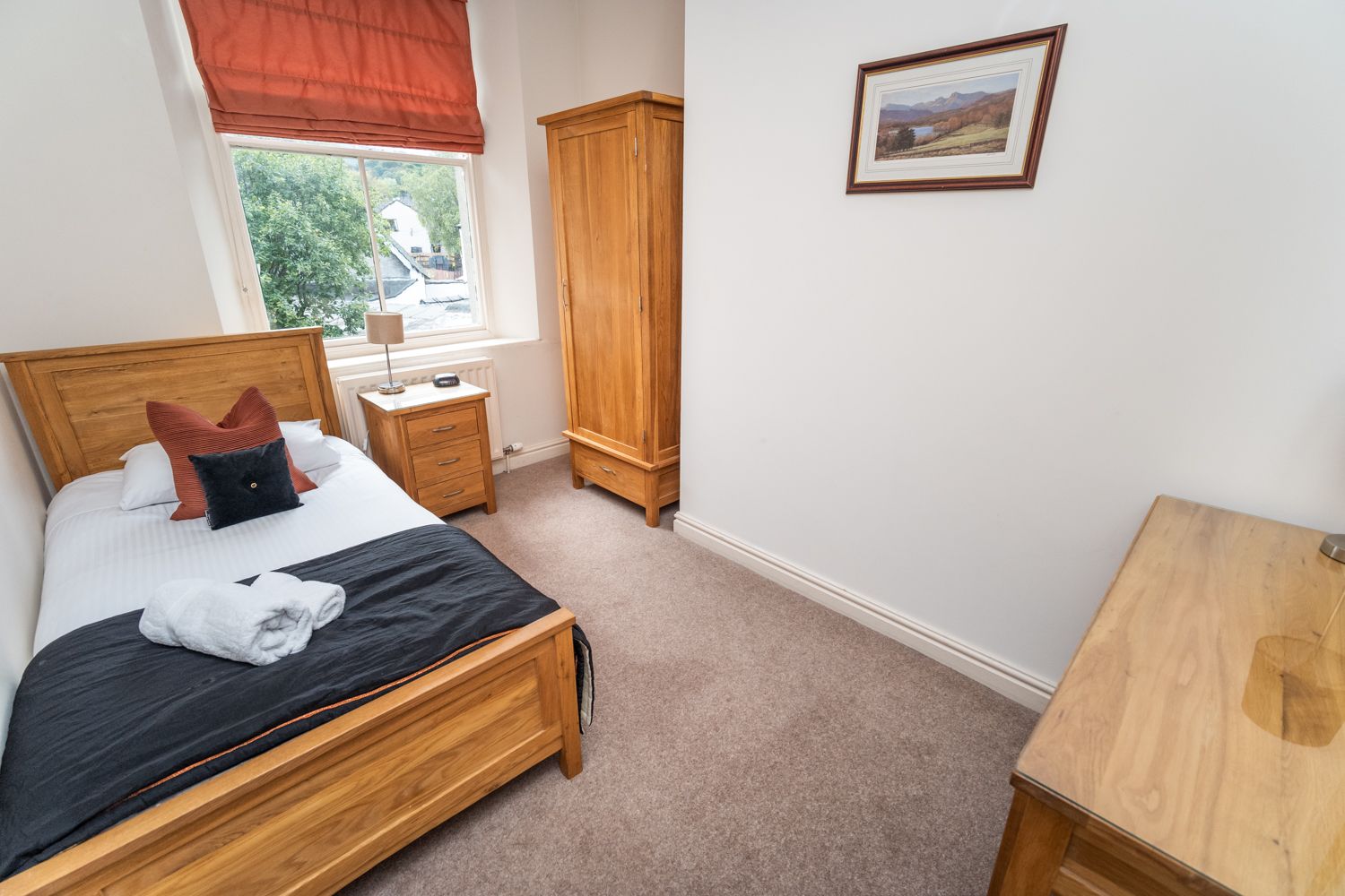 A well sized single bedroom with ample storage space