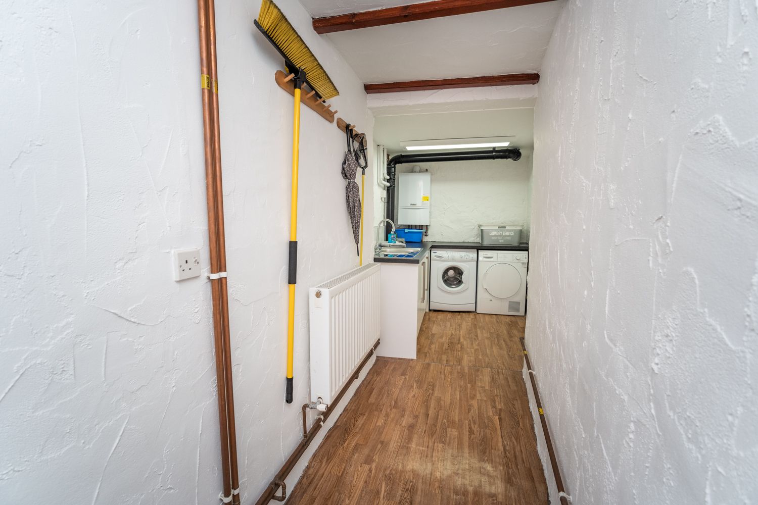 The washer and drier can also be found in the utility area