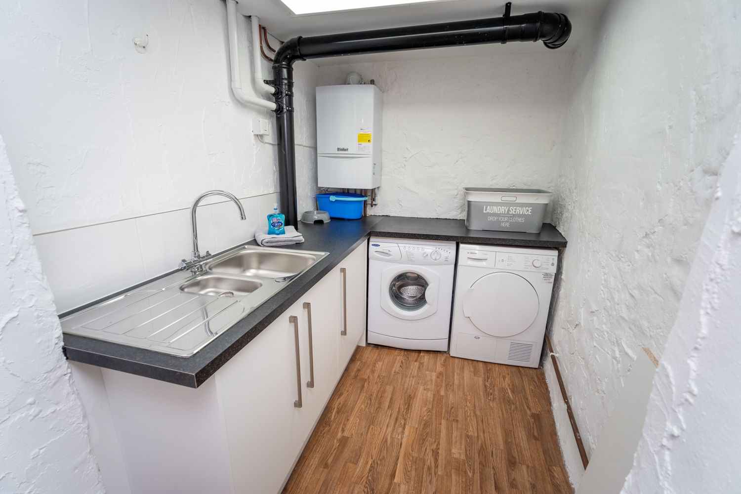 This handy utility area can be used to store bikes and prams