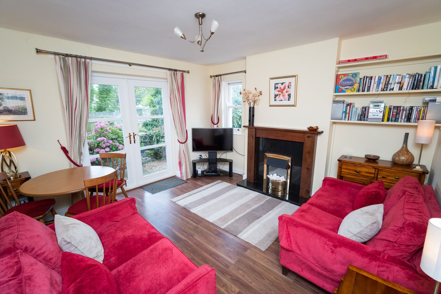 A beautifully decorated living area at the rear of the property