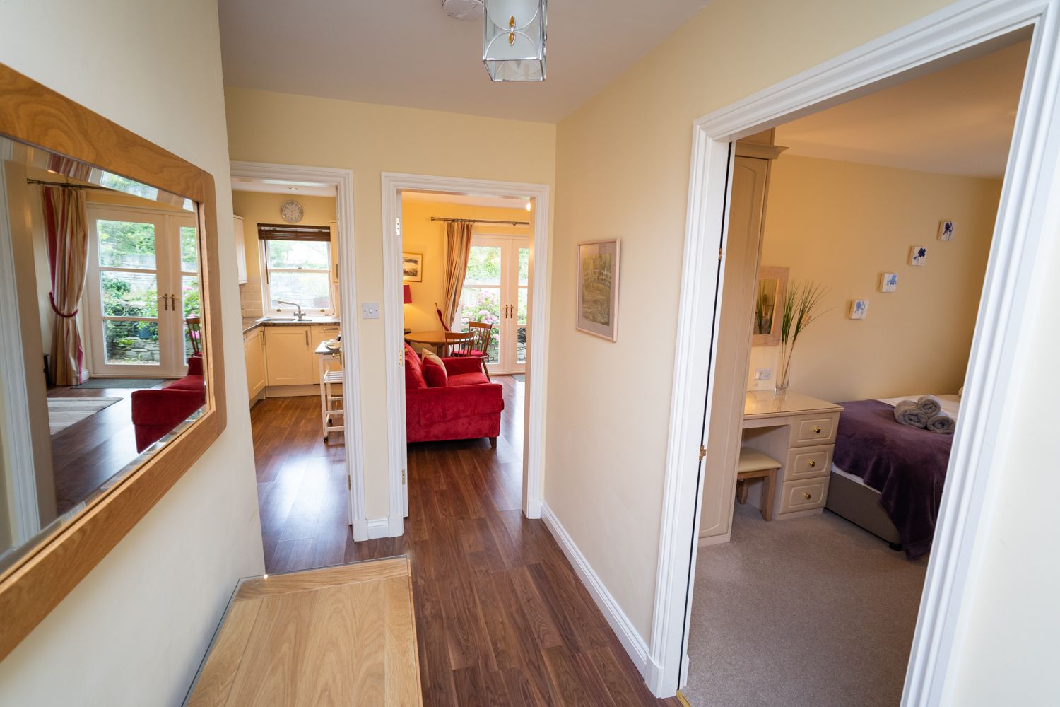 The front door opens into the hallway of the apartment, with space for boots and coats