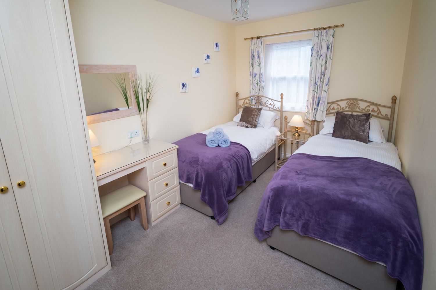 The twin bedroom features extra long single beds