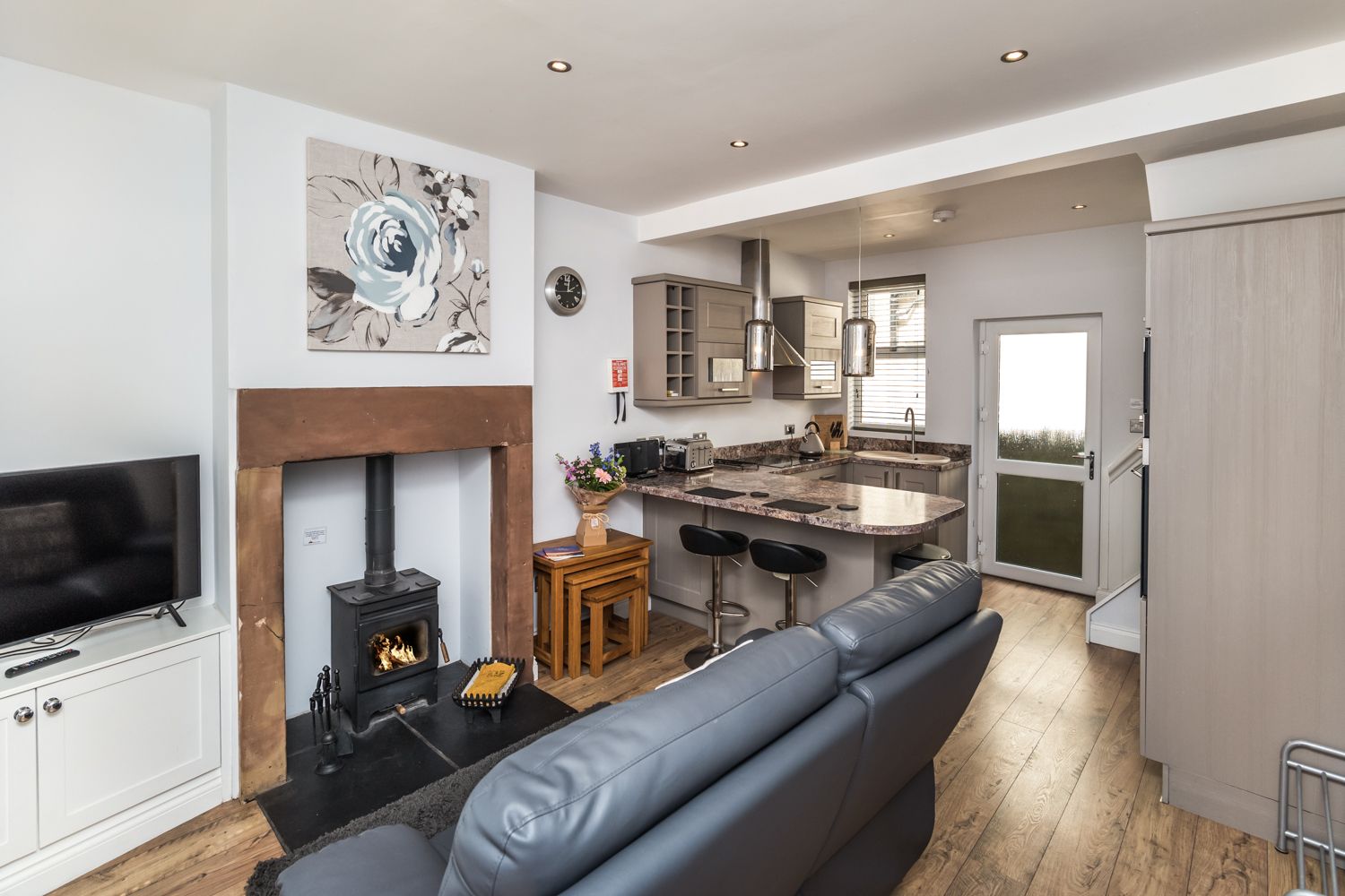 The open plan living and kitchen area is cosy and stylish, pets are also welcome at Isabel Cottage