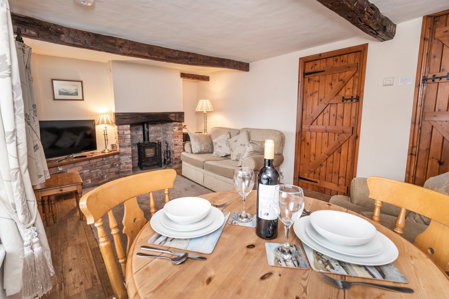 Cosy up next to the log burning stove in the colder months