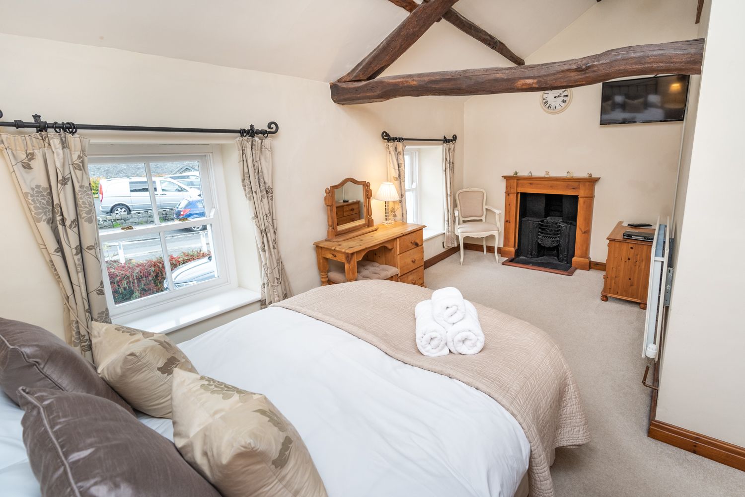 You can enjoy your favourite shows on the wall mounted TV in the master bedroom